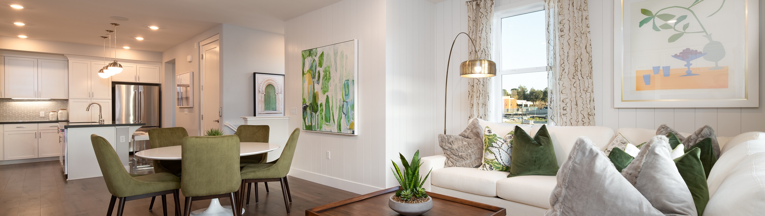 A living room with a couch and chairs.