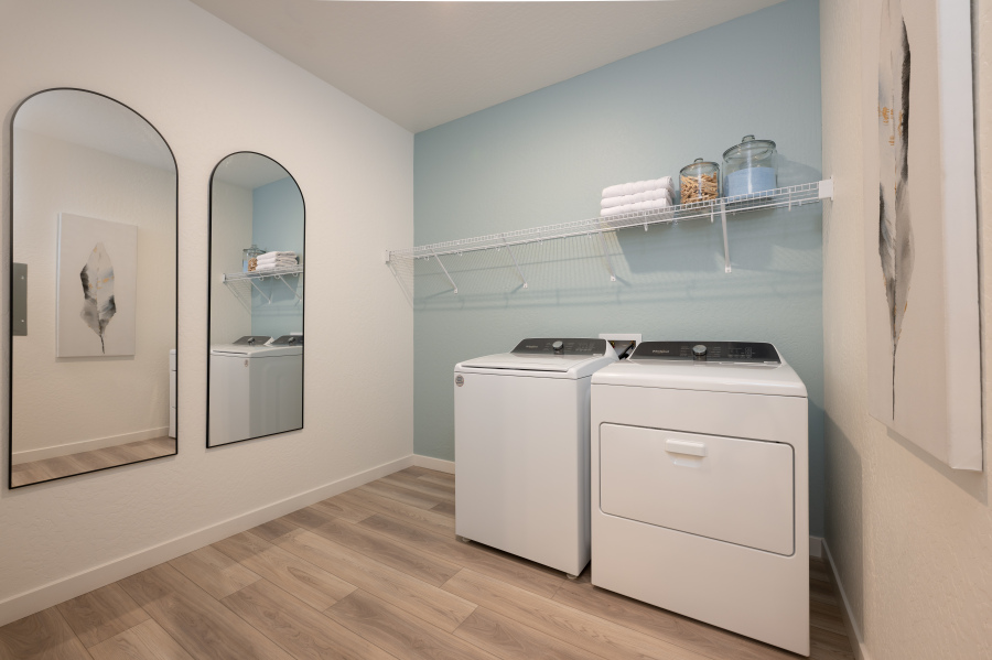 A kitchen with a white cabinet.