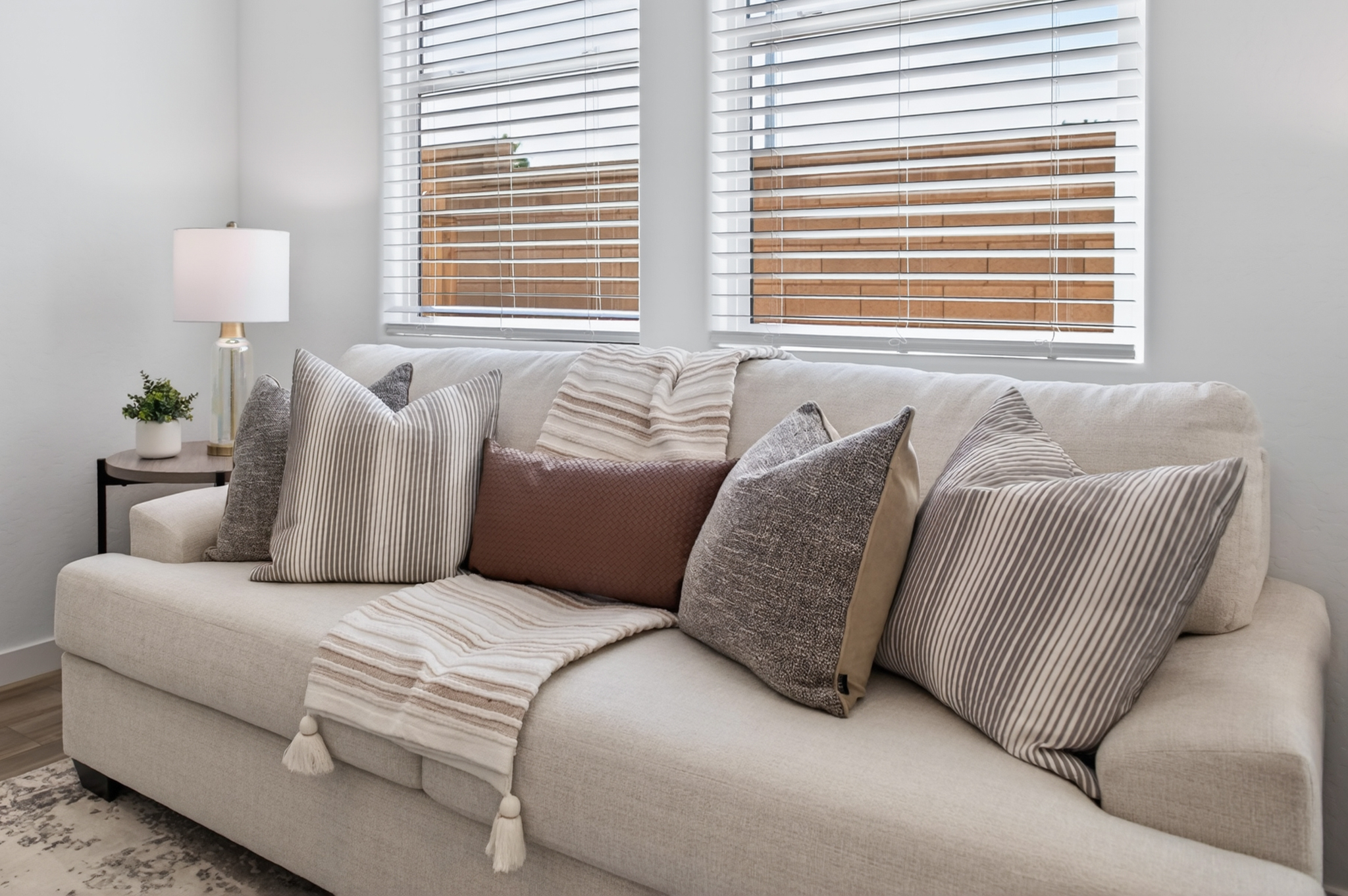 A couch with pillows.