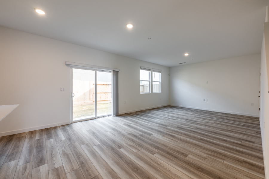 A room with a wood floor and a wood floor.