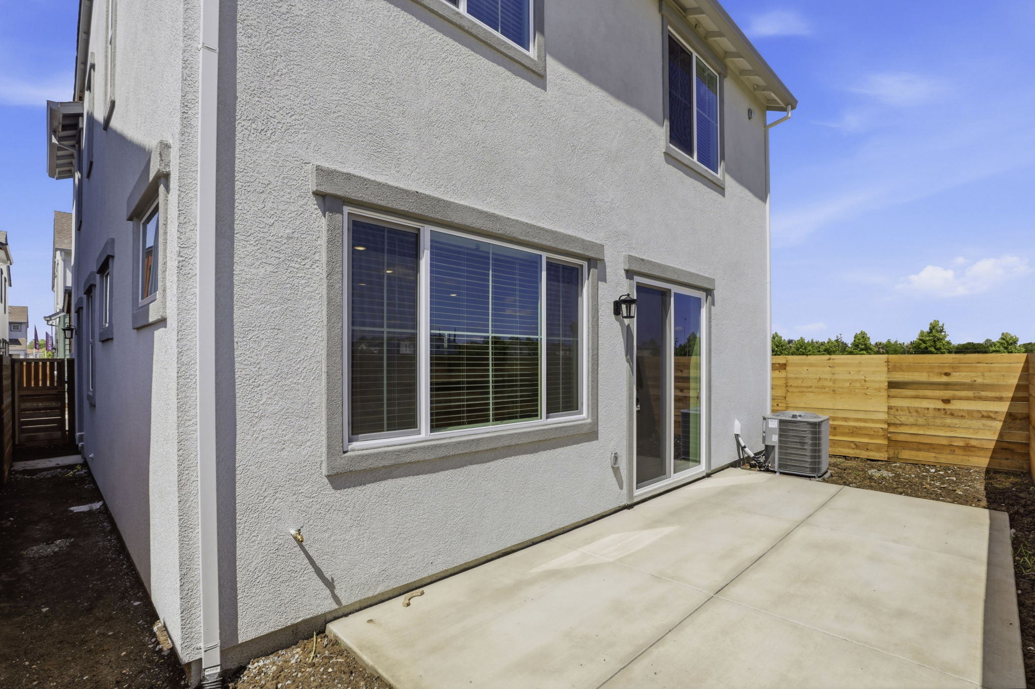 A white house with a fence.