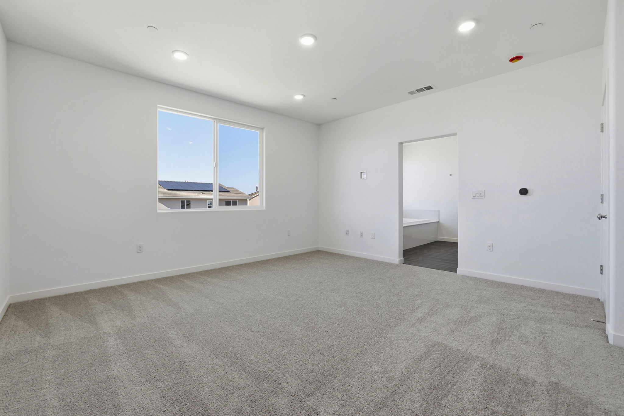 A room with a window and a door.