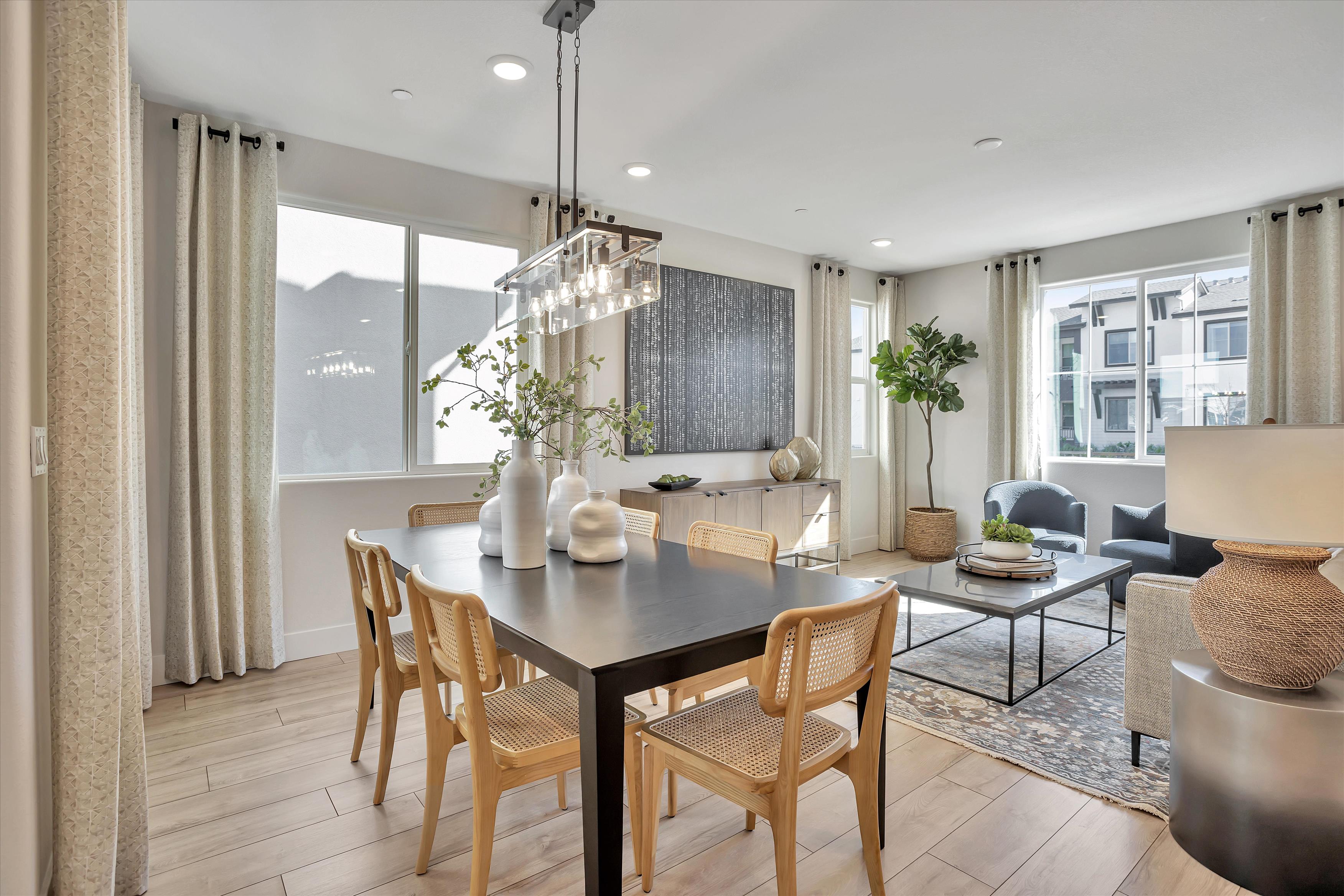A dining room with a large window.