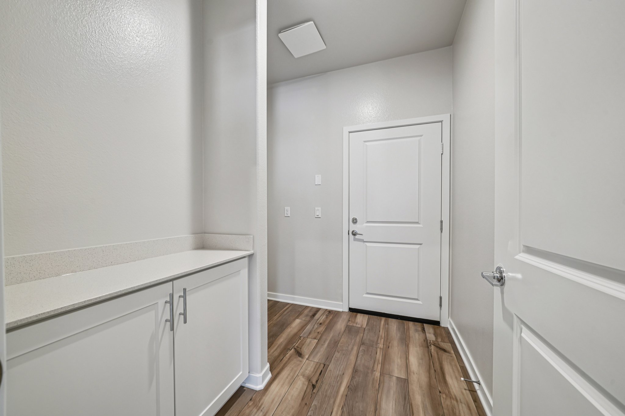 A room with white cabinets.