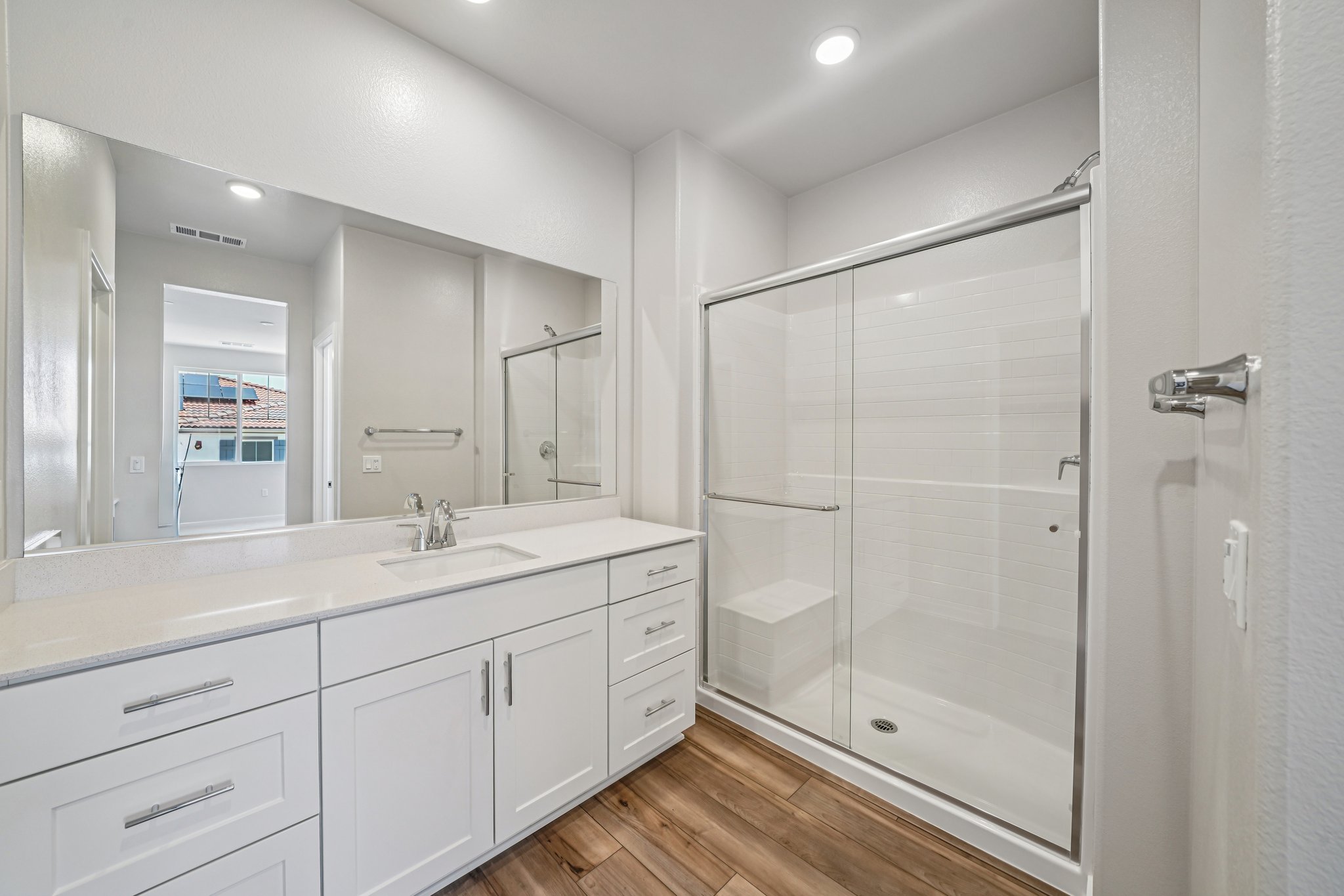A bathroom with a glass shower.