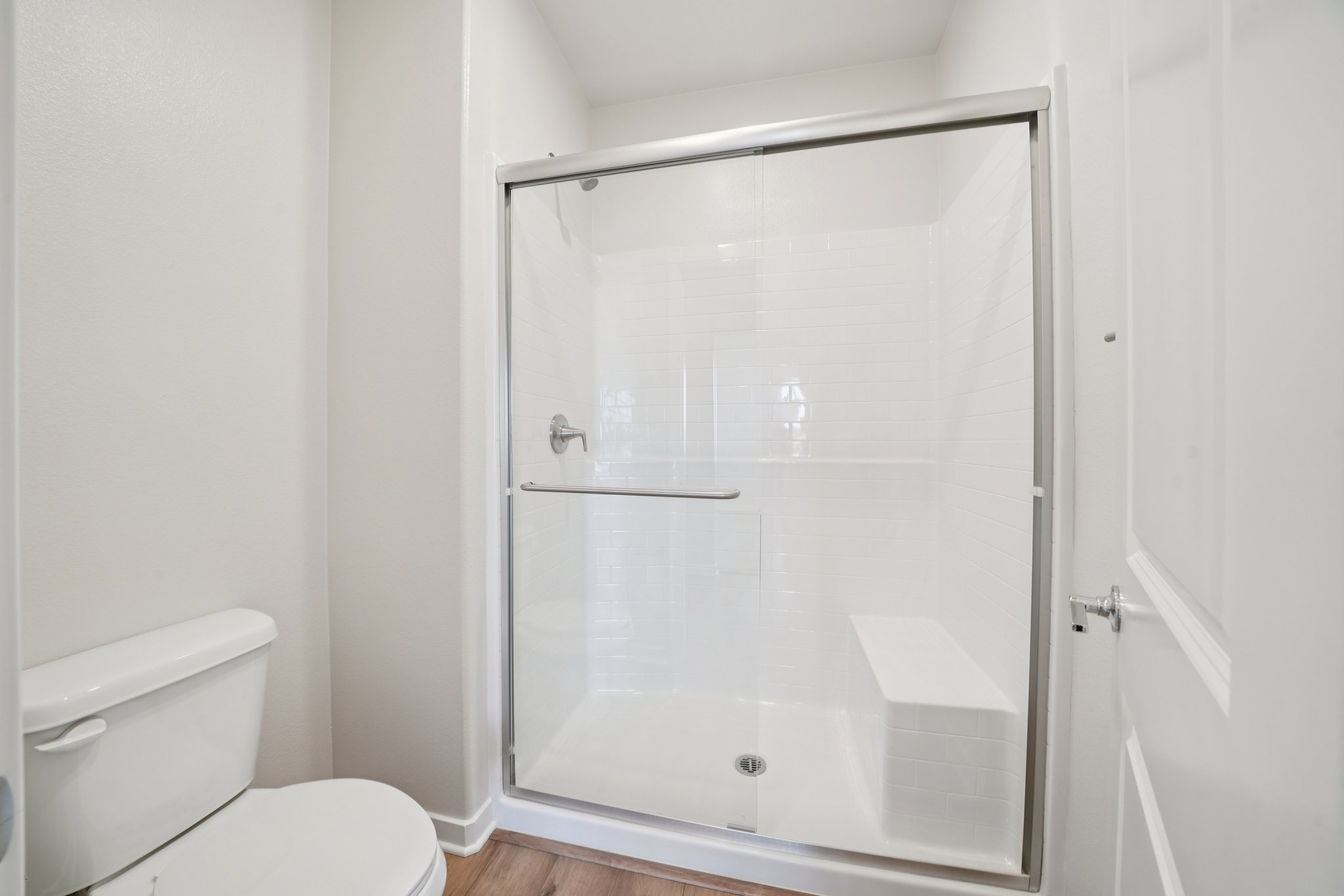 A shower unit in a bathroom.