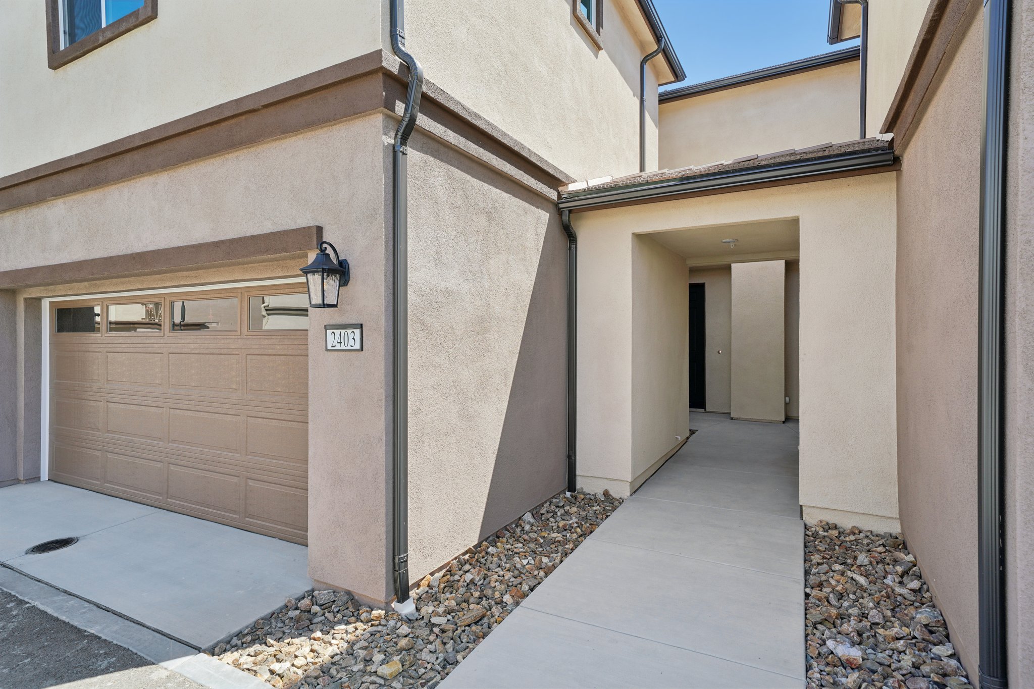 A building with a stone walkway.