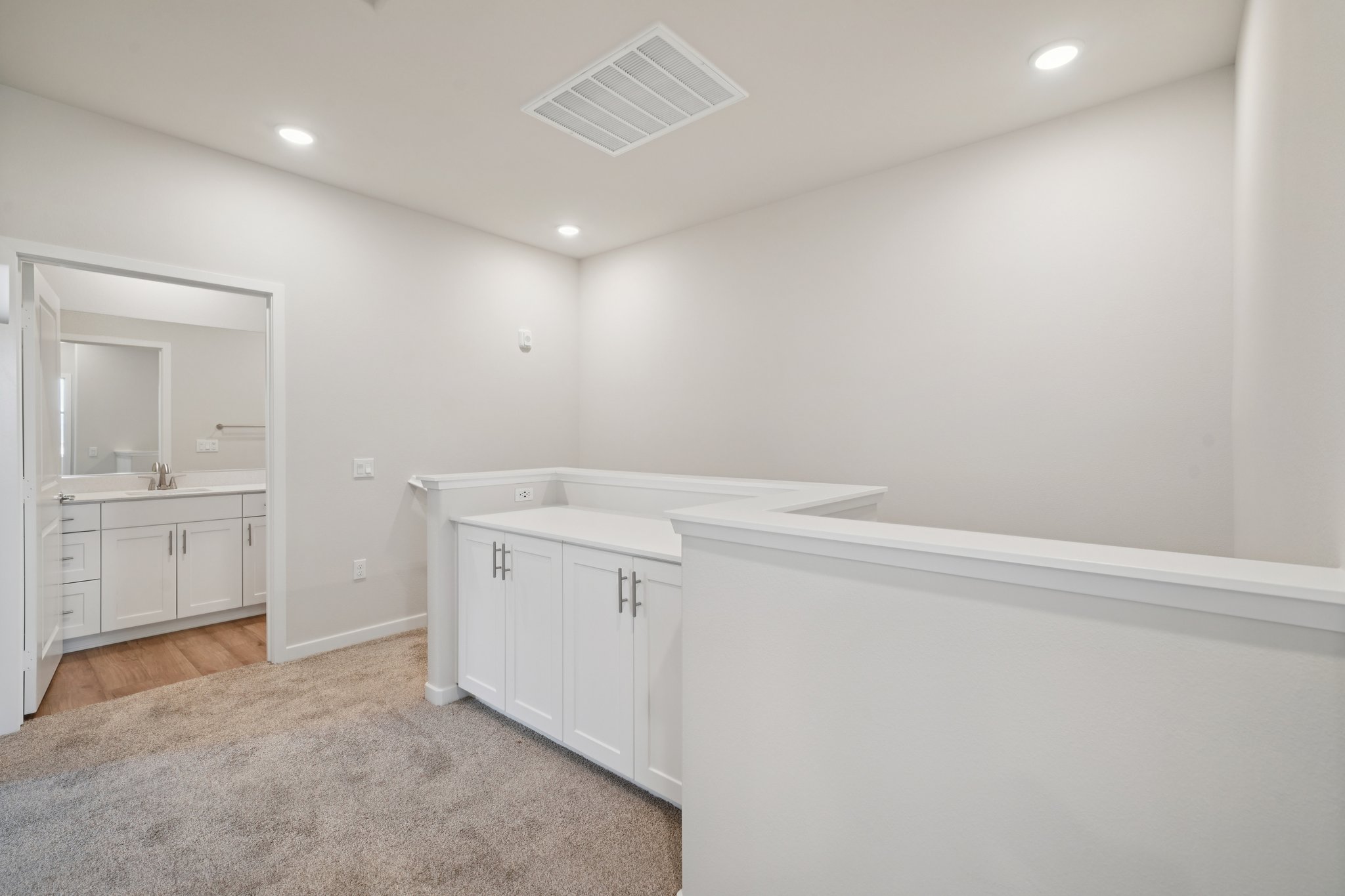A white kitchen with white cabinets.