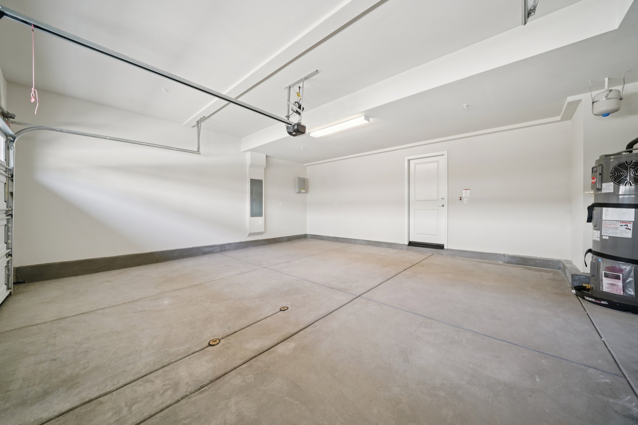 A room with a wood floor and white walls.