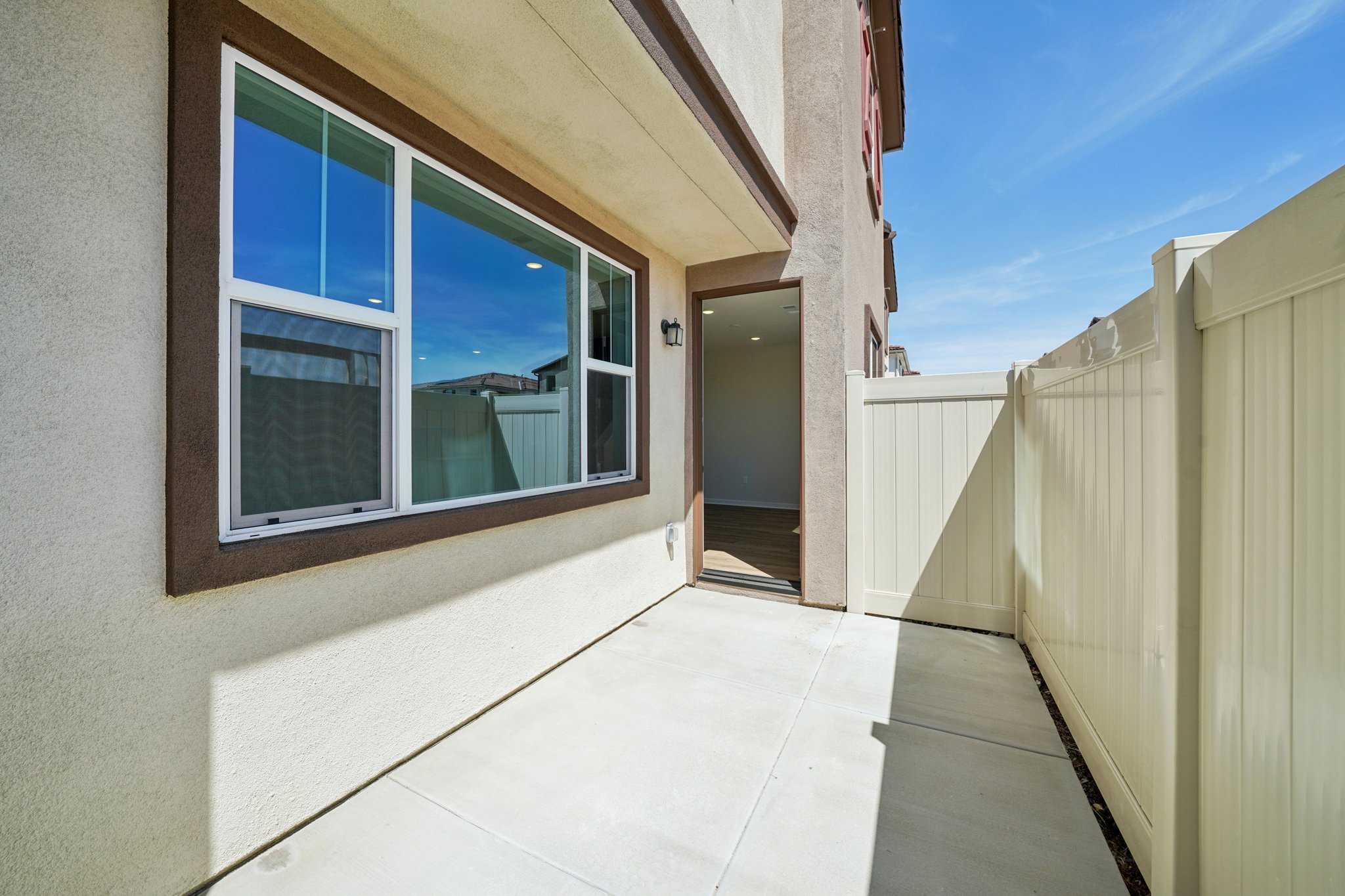 A white house with a large window.