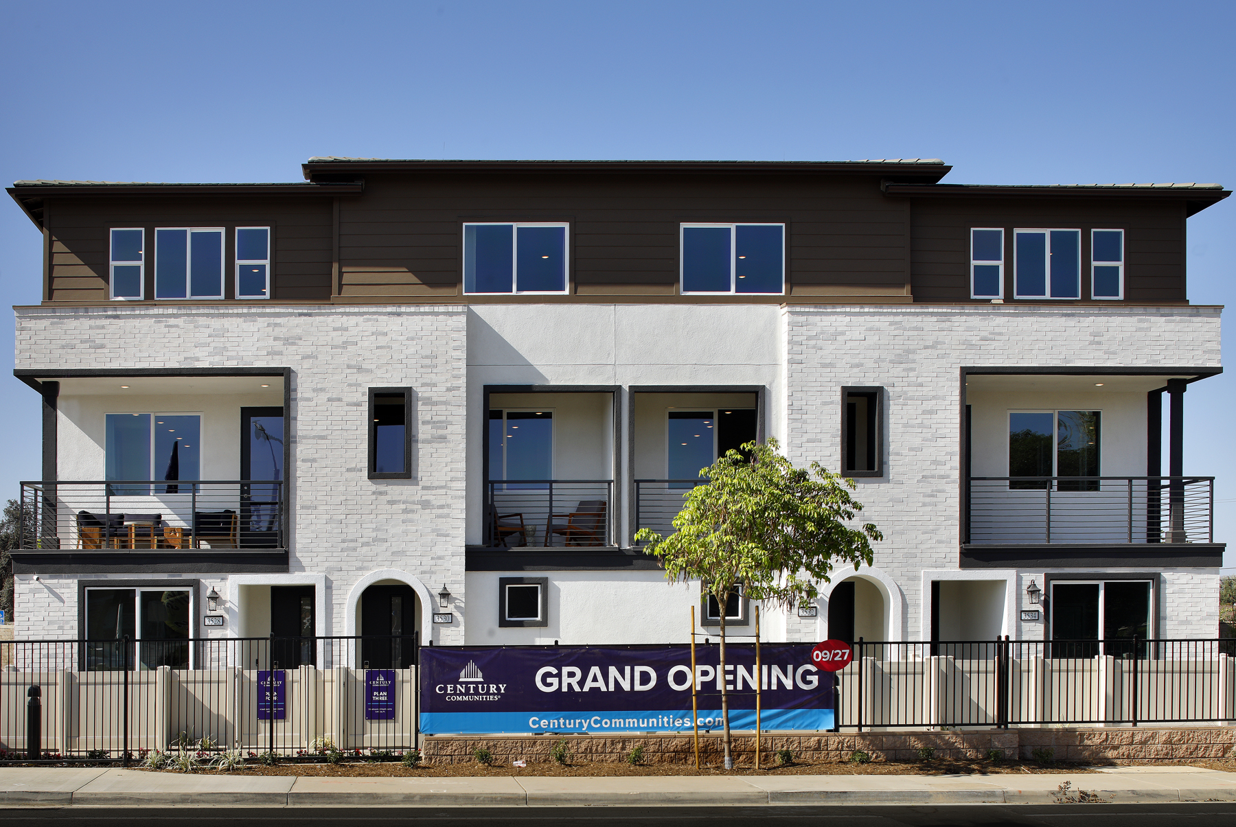 A building with a sign in front.