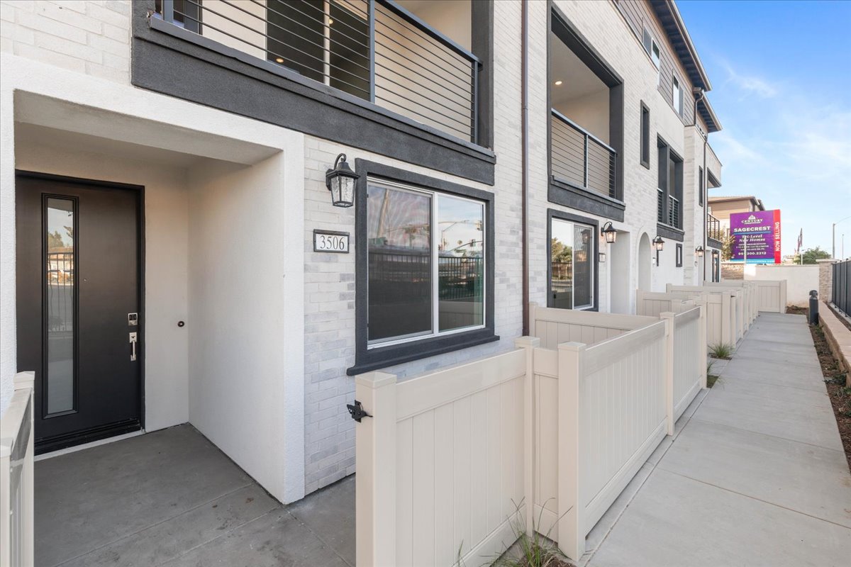 A building with a white fence.