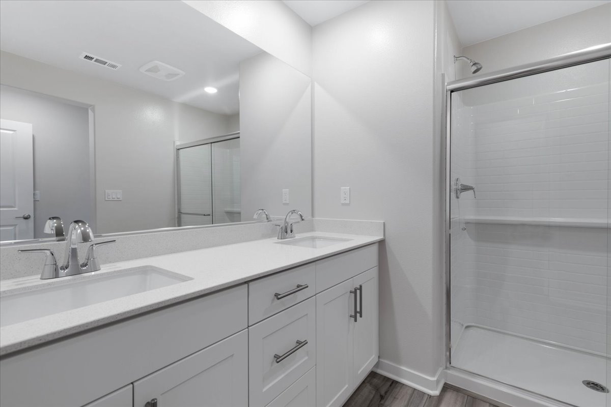 A bathroom with a glass shower.