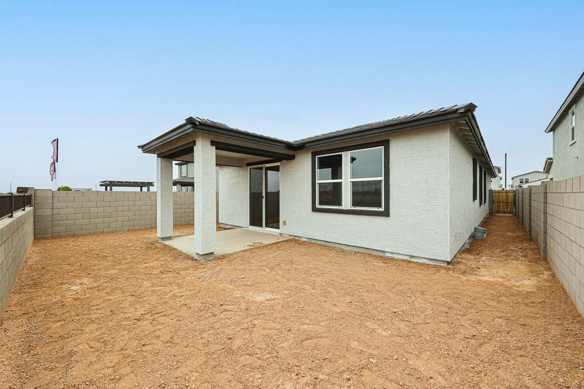 A house with a dirt yard.