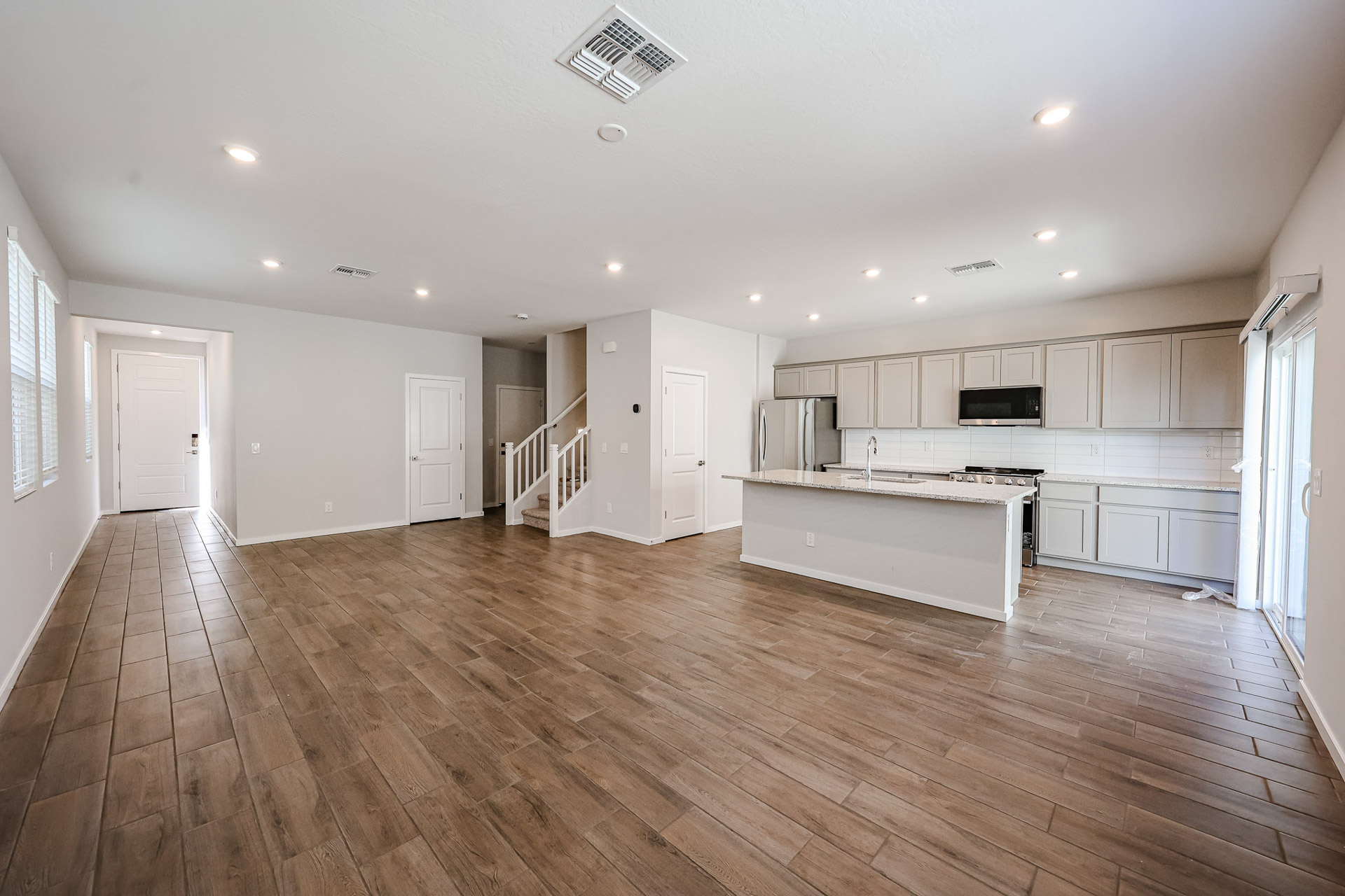 A large kitchen with white cabinets.