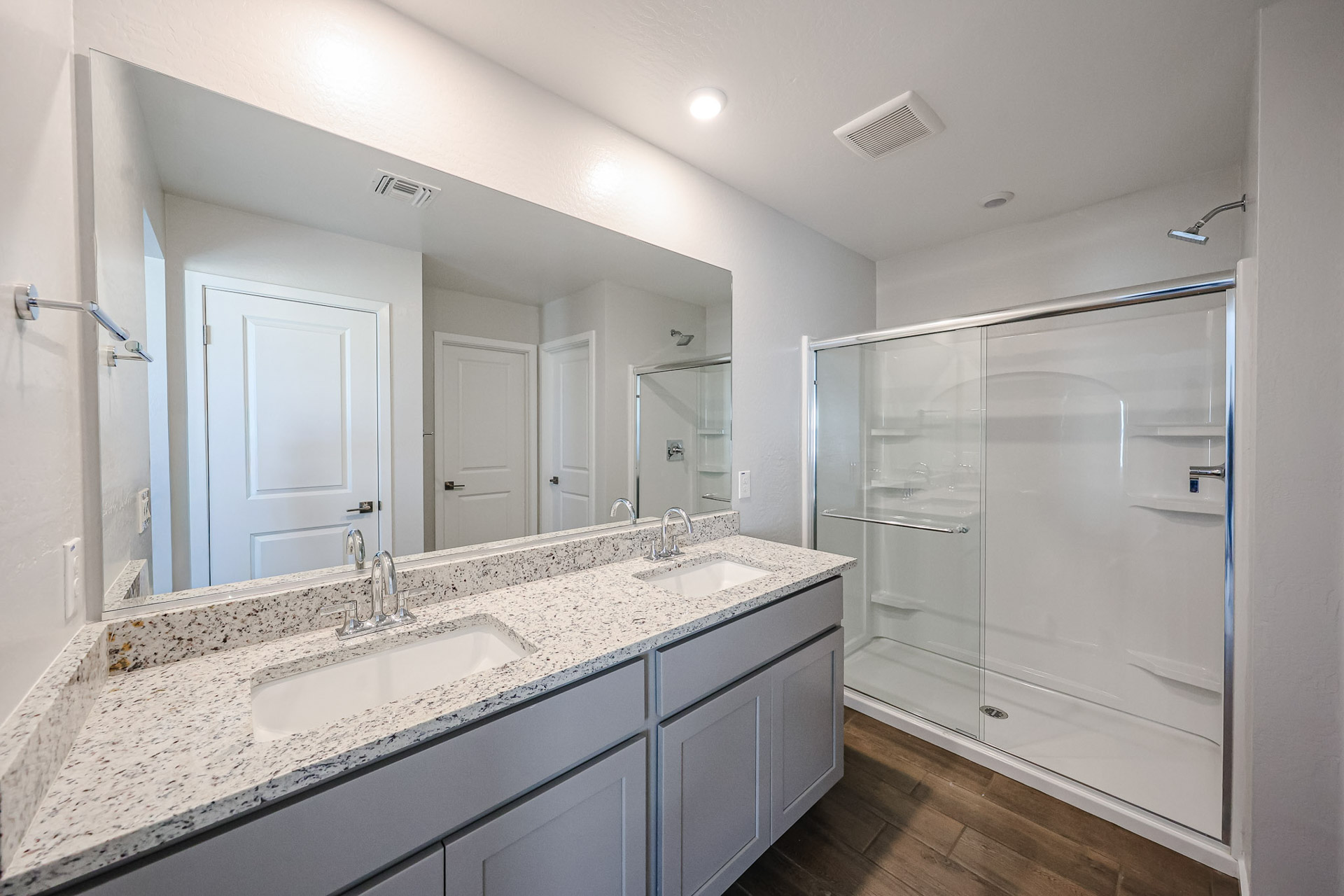 A bathroom with a glass shower.