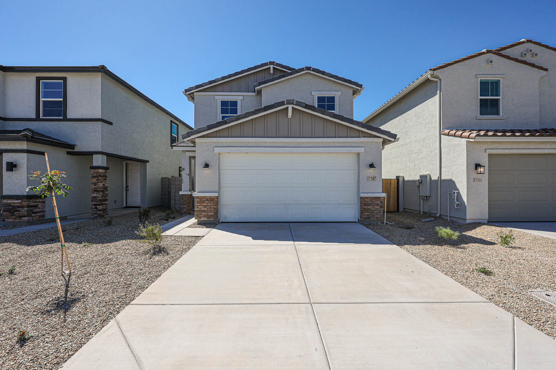 A driveway leading to a house.