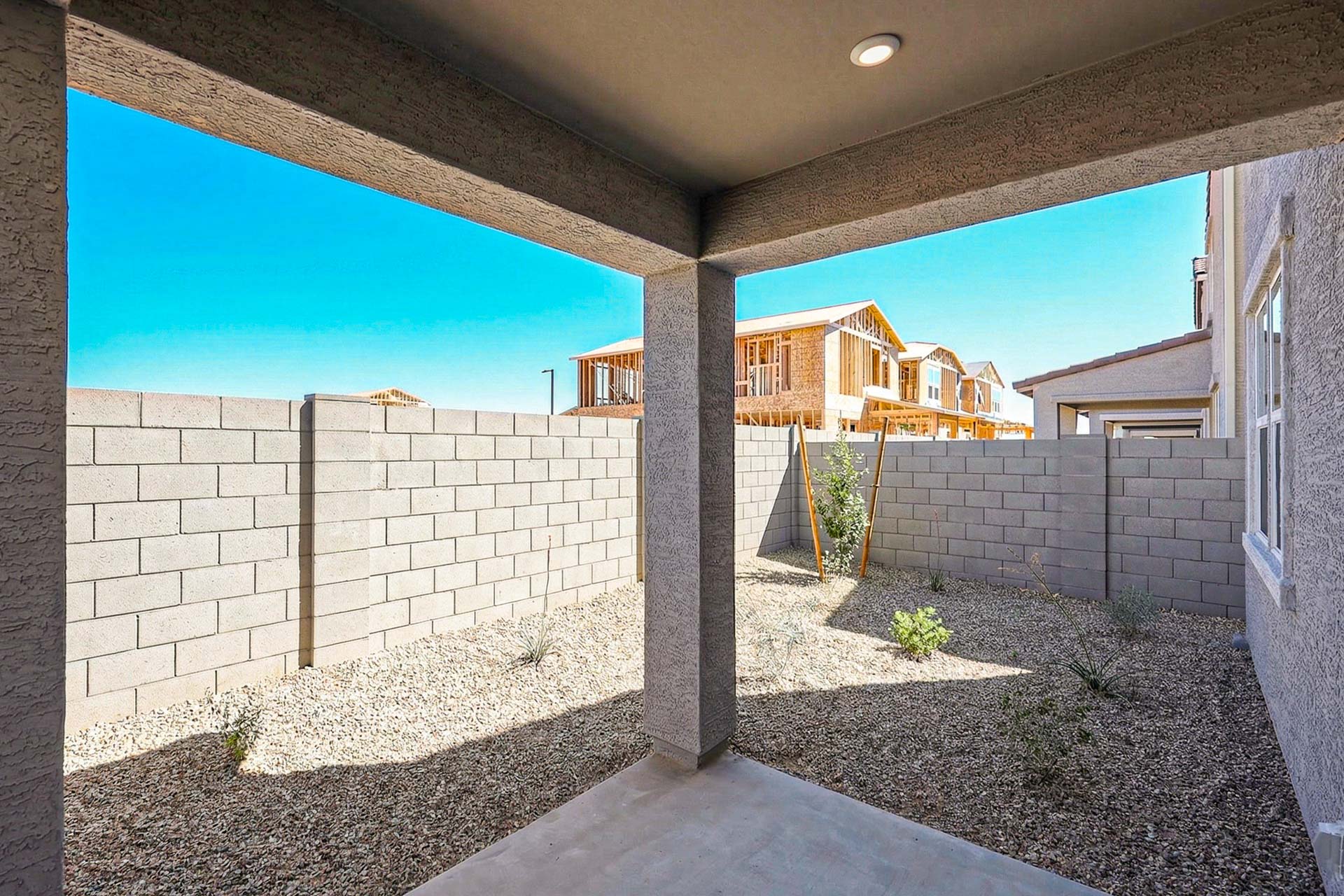 A stone wall with a stone wall and a stone wall with a blue sky.