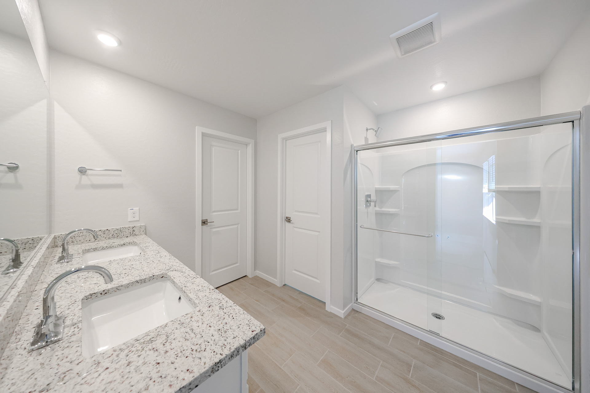 A bathroom with a glass shower.