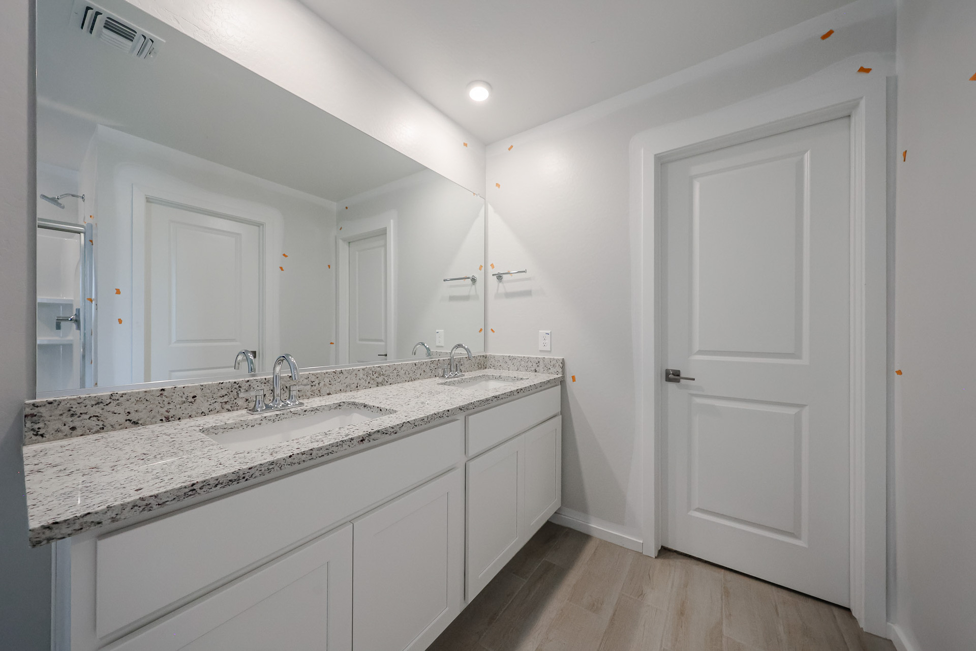 A bathroom with a marble countertop.