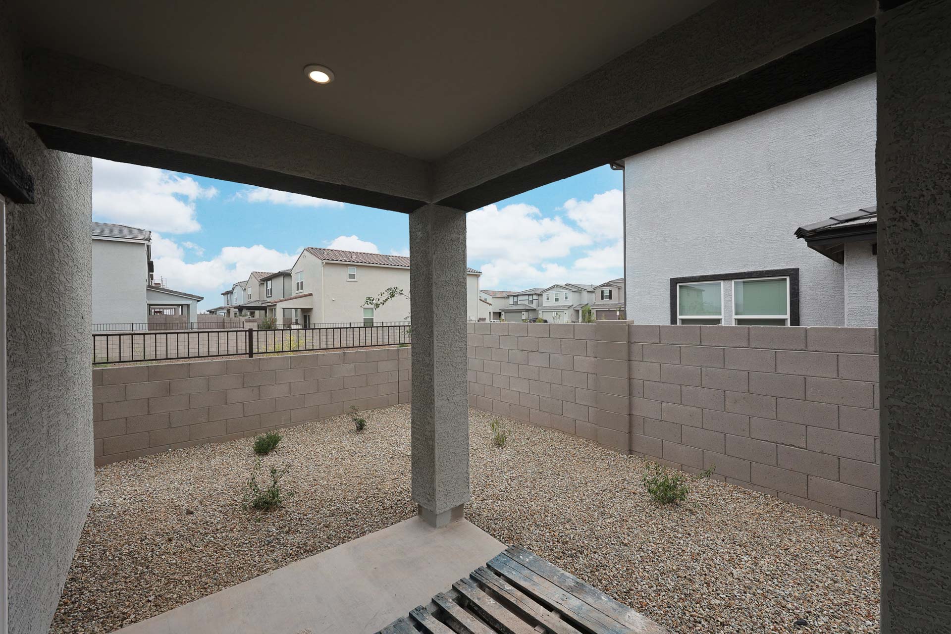 A stone wall with a stone walkway.