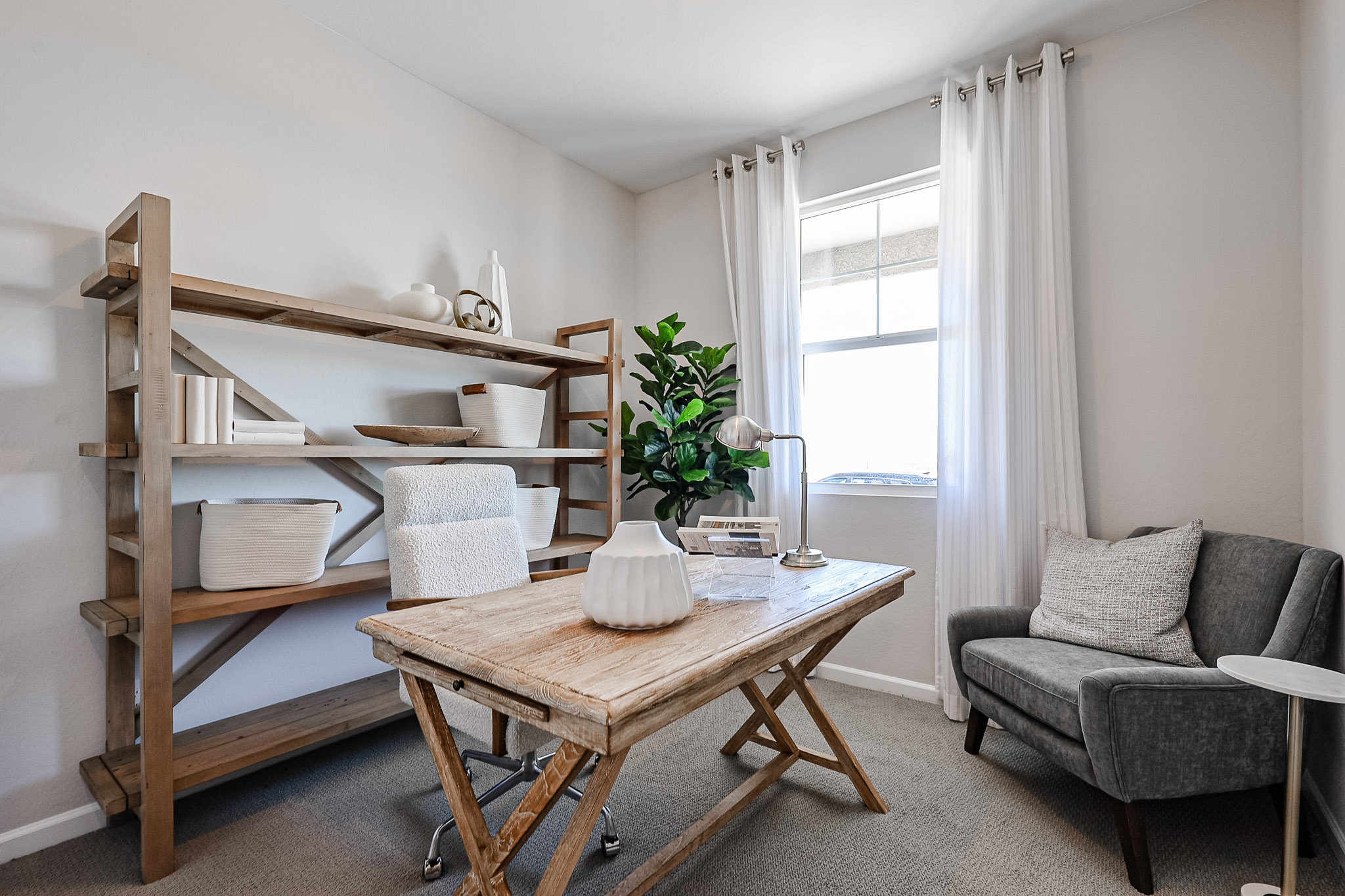 A room with a table and chairs.