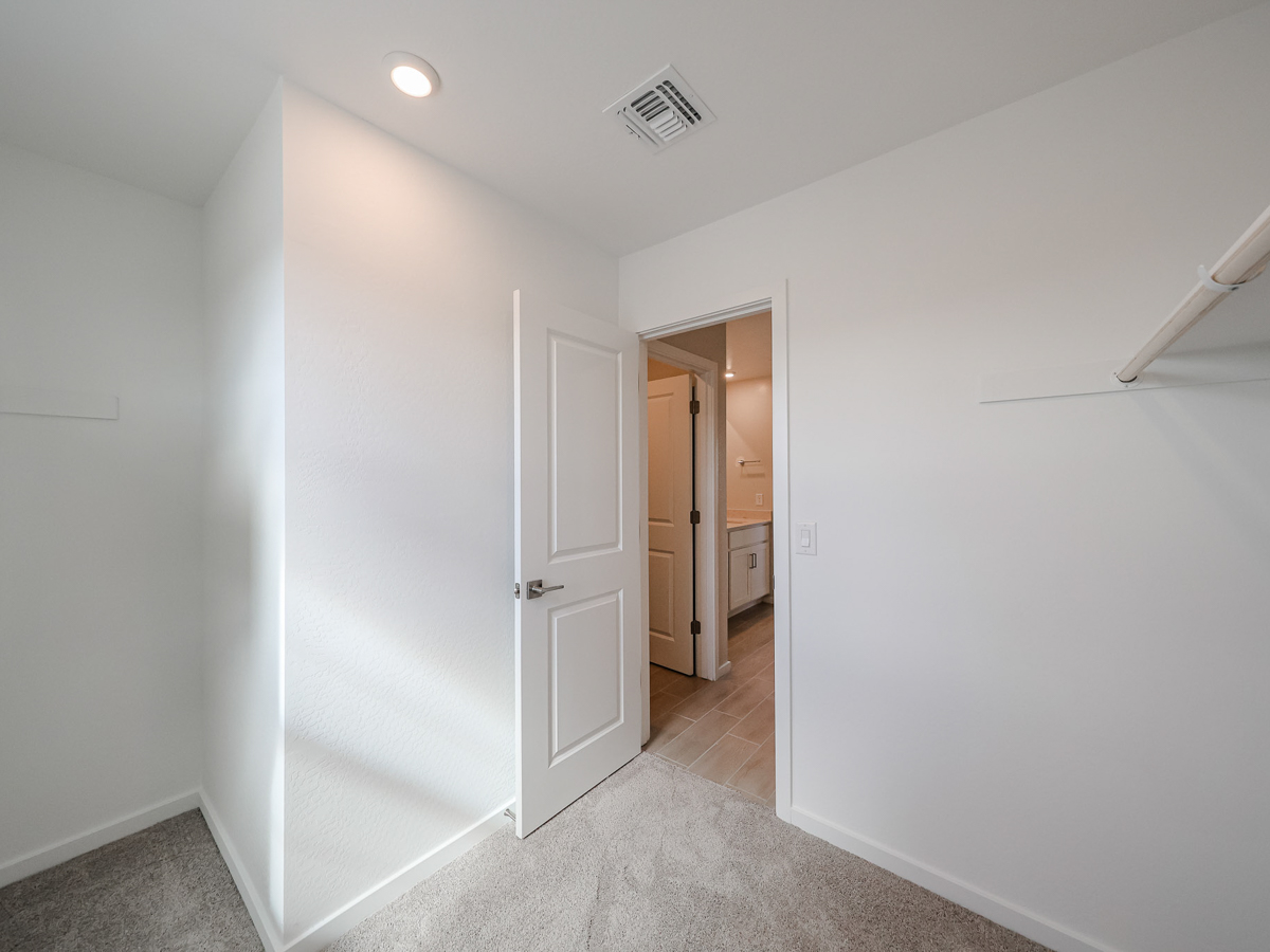 A hallway with white walls.