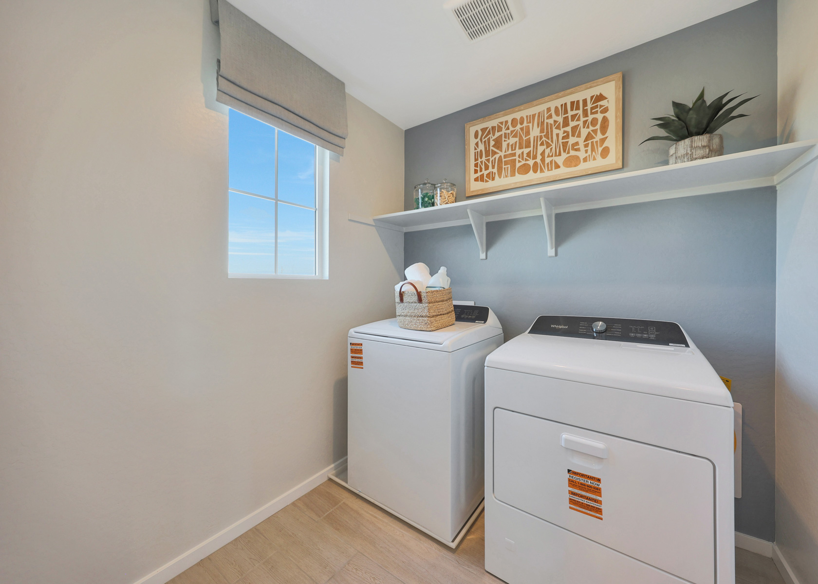 A laundry room with a washer and dryer.