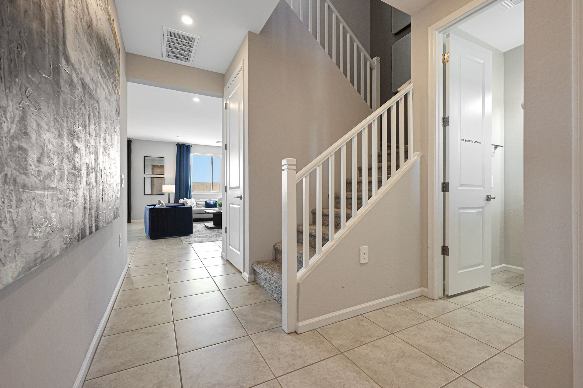 A hallway with white walls.