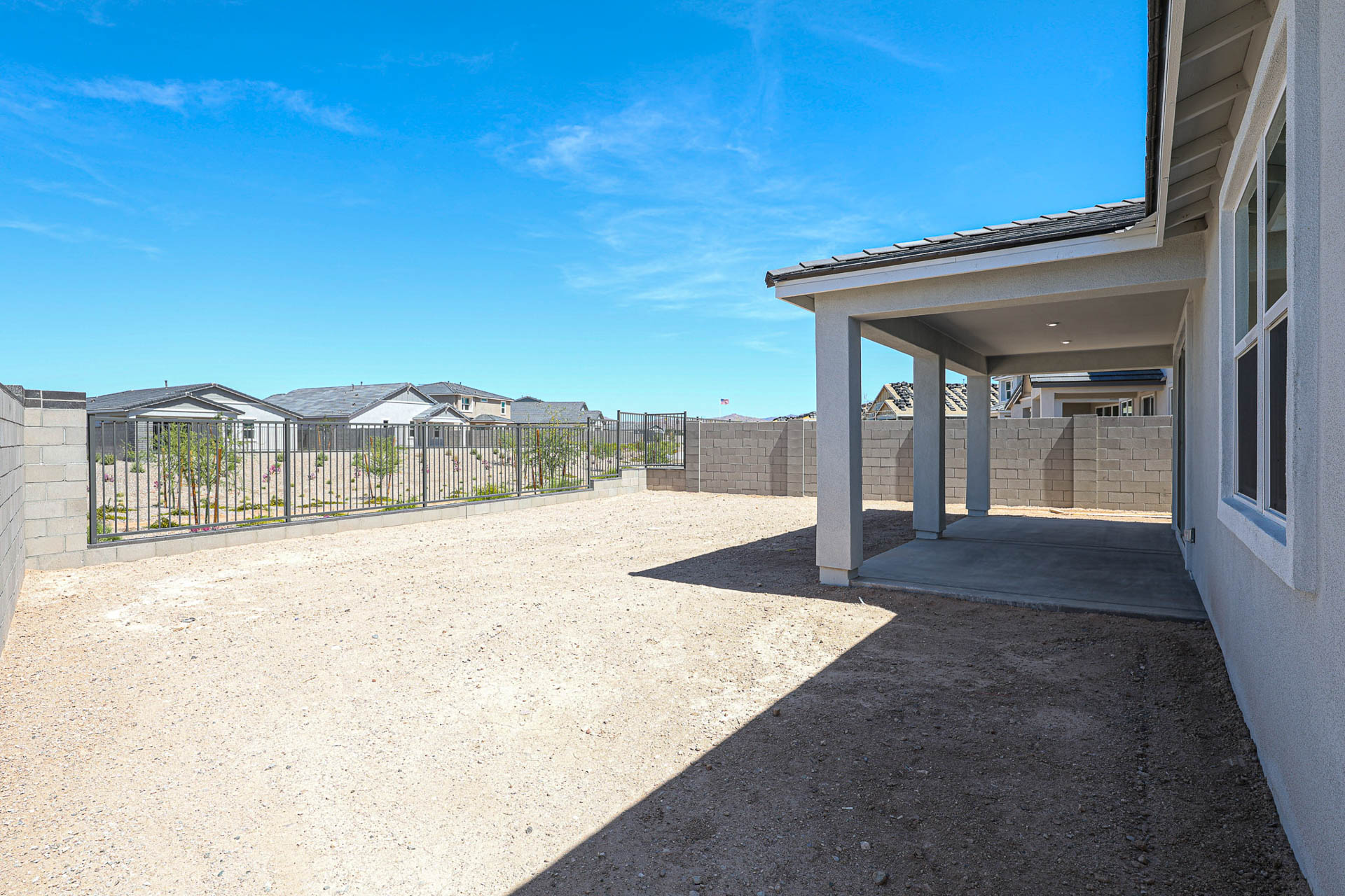 A fenced in driveway.