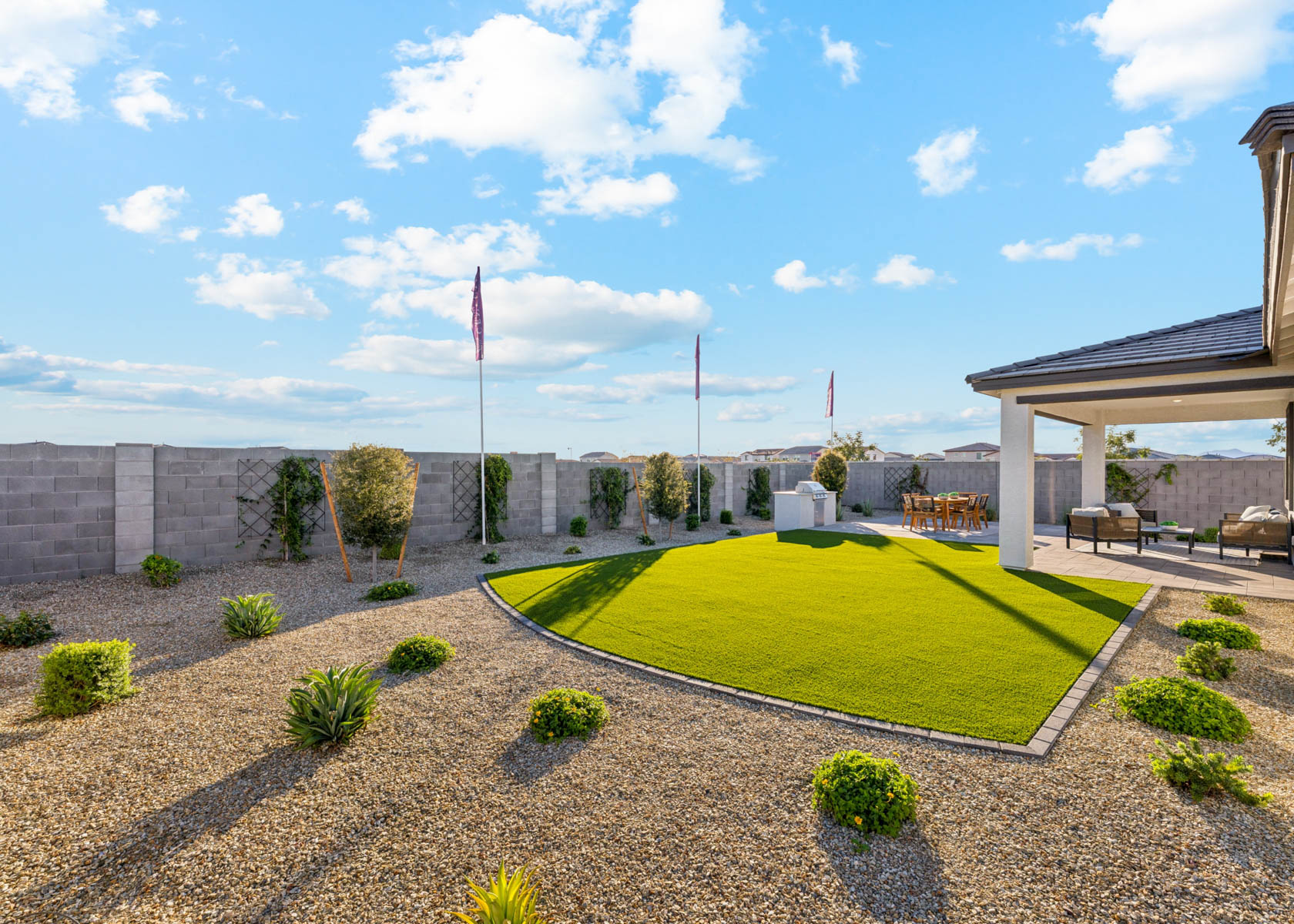 A large green lawn with a flag.