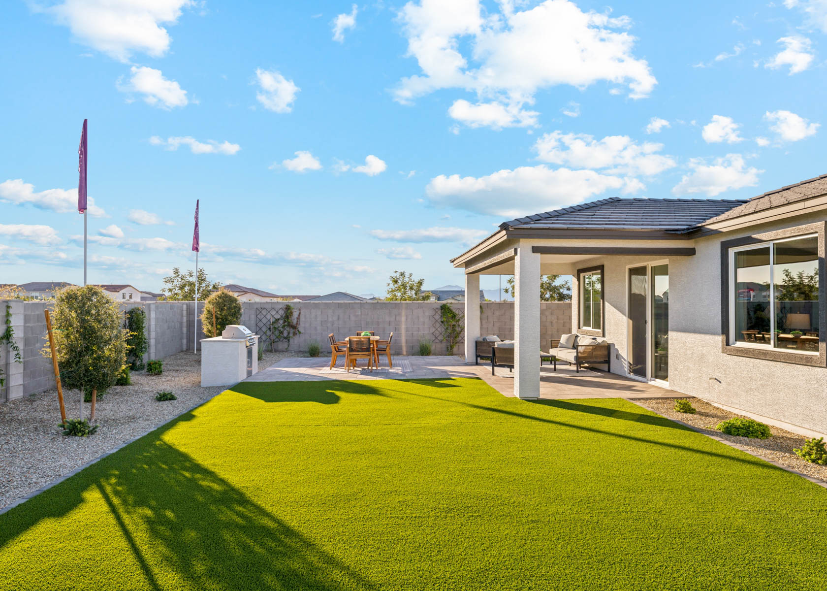 A building with a lawn and a flag in the front.
