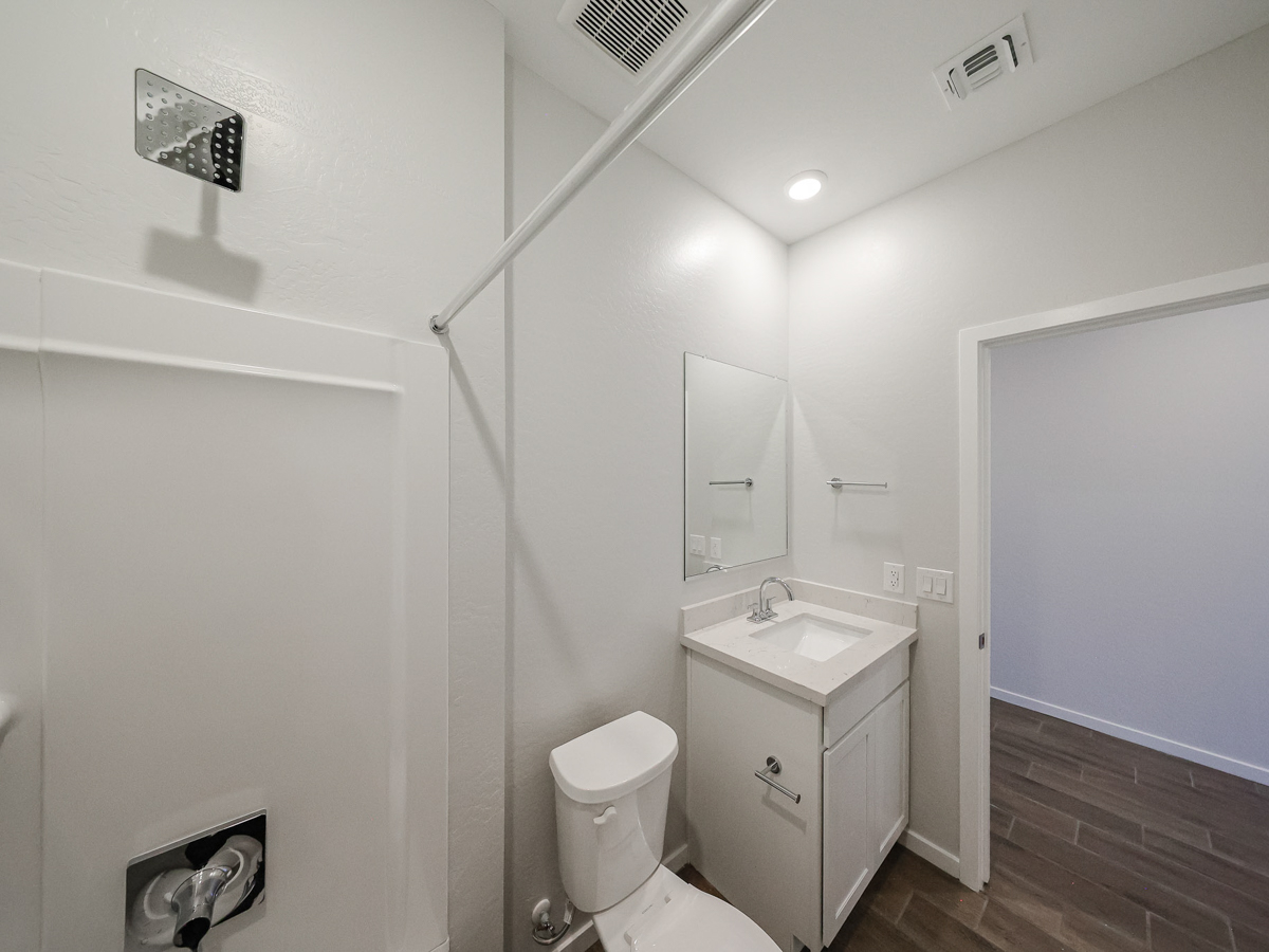 A bathroom with a toilet and sink.