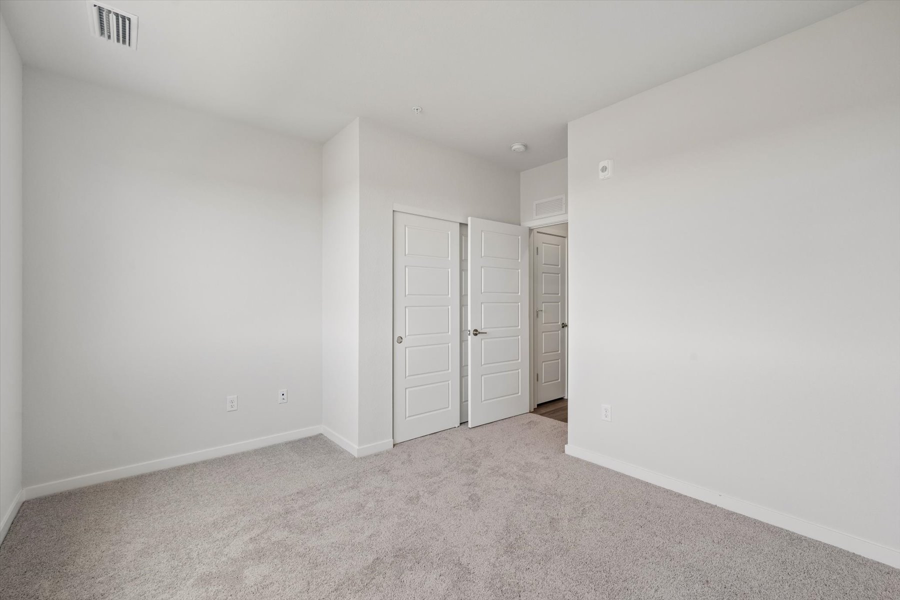 A room with white doors.