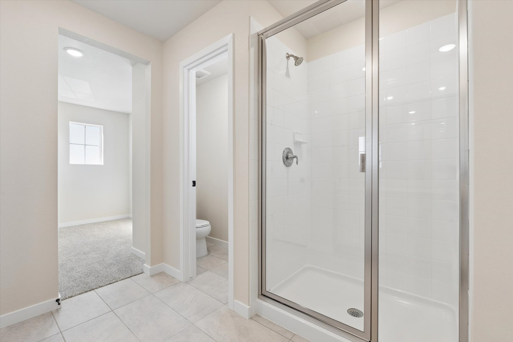 A bathroom with a glass shower.