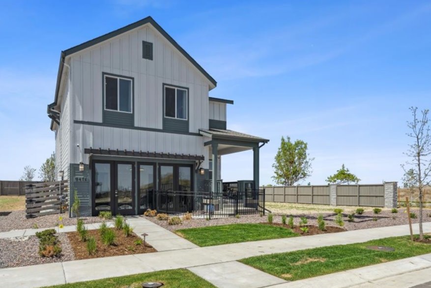 A house with a fence and a driveway.
