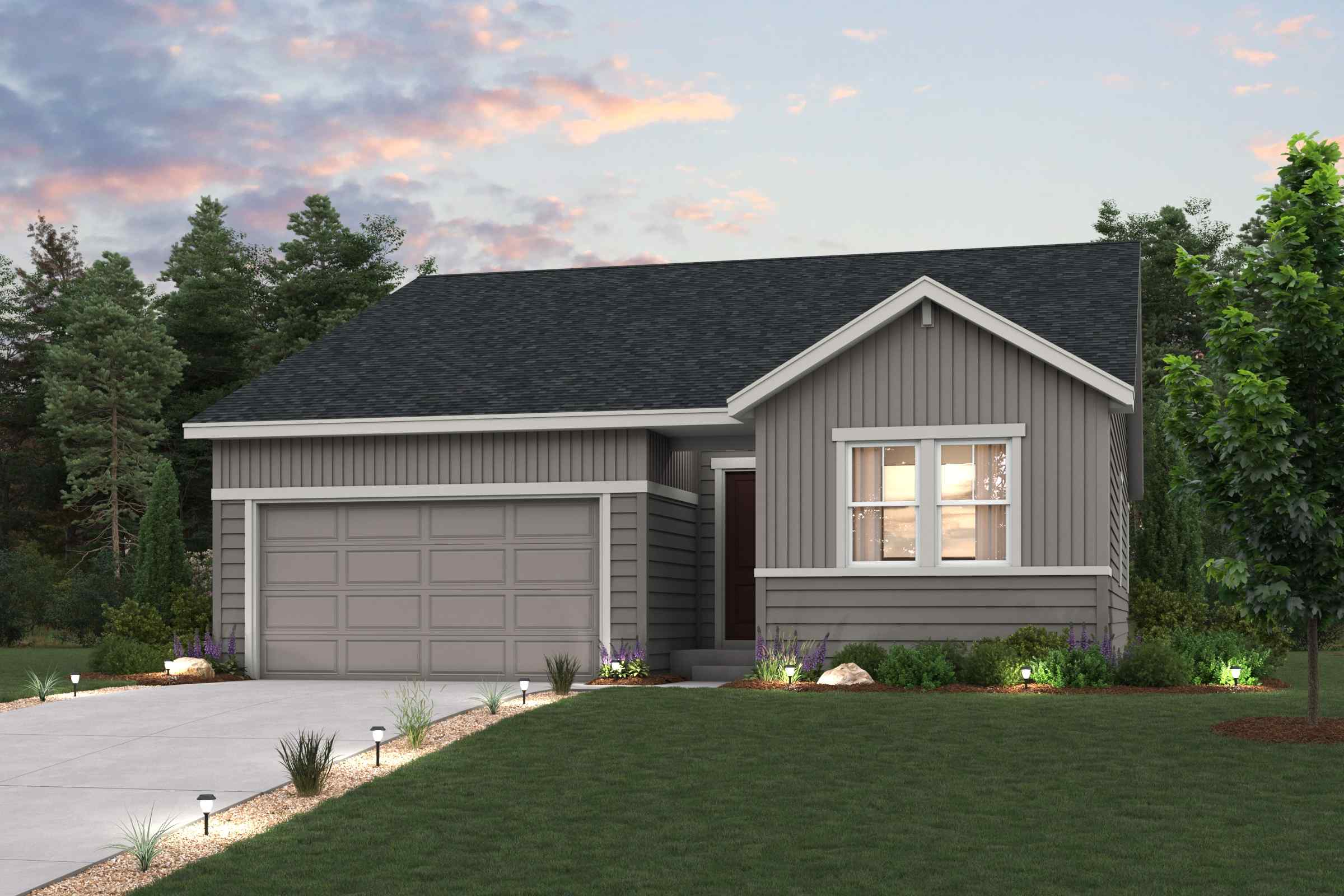 A house with a garage and trees.