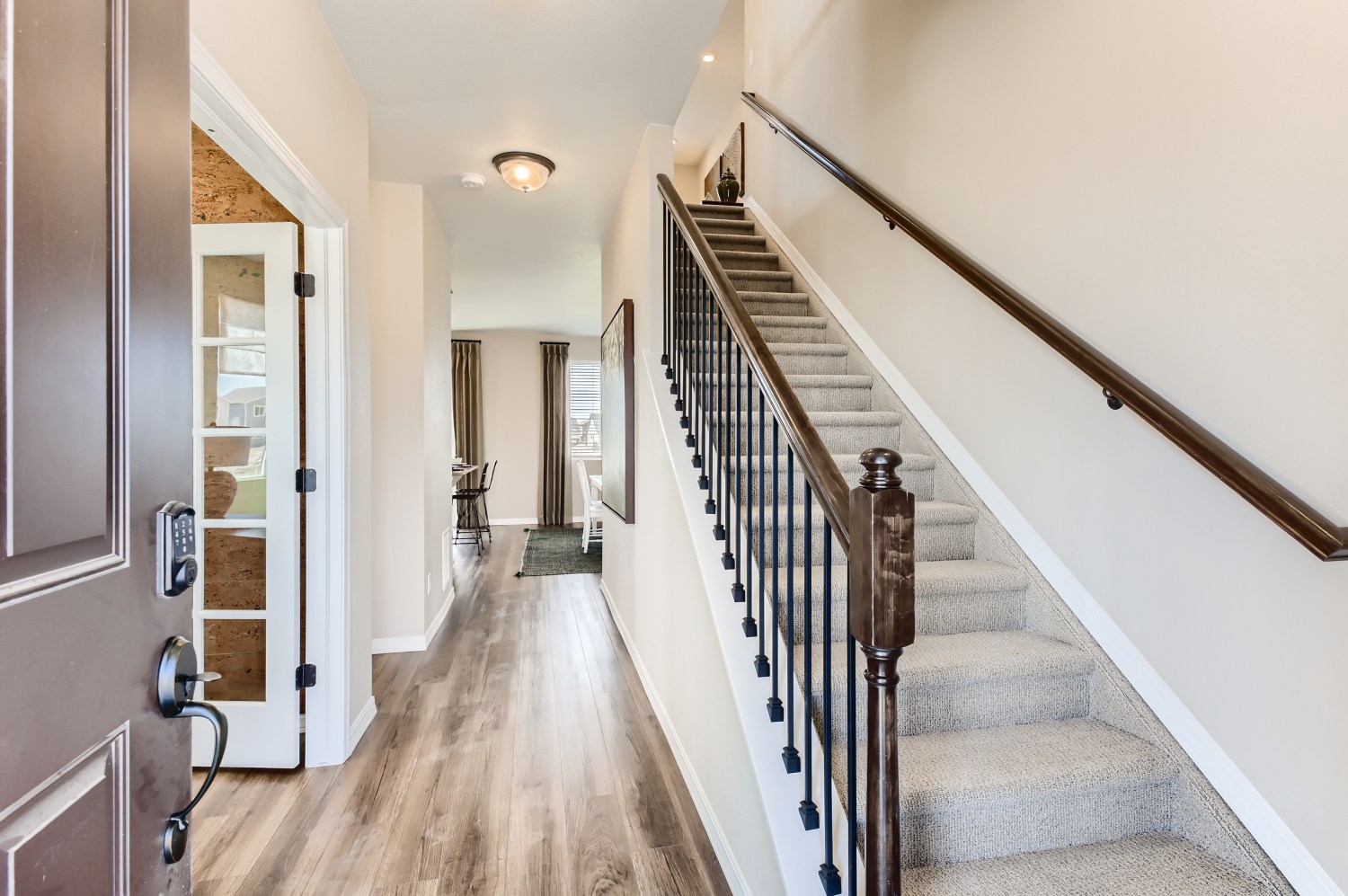 A long hallway with a wood railing.