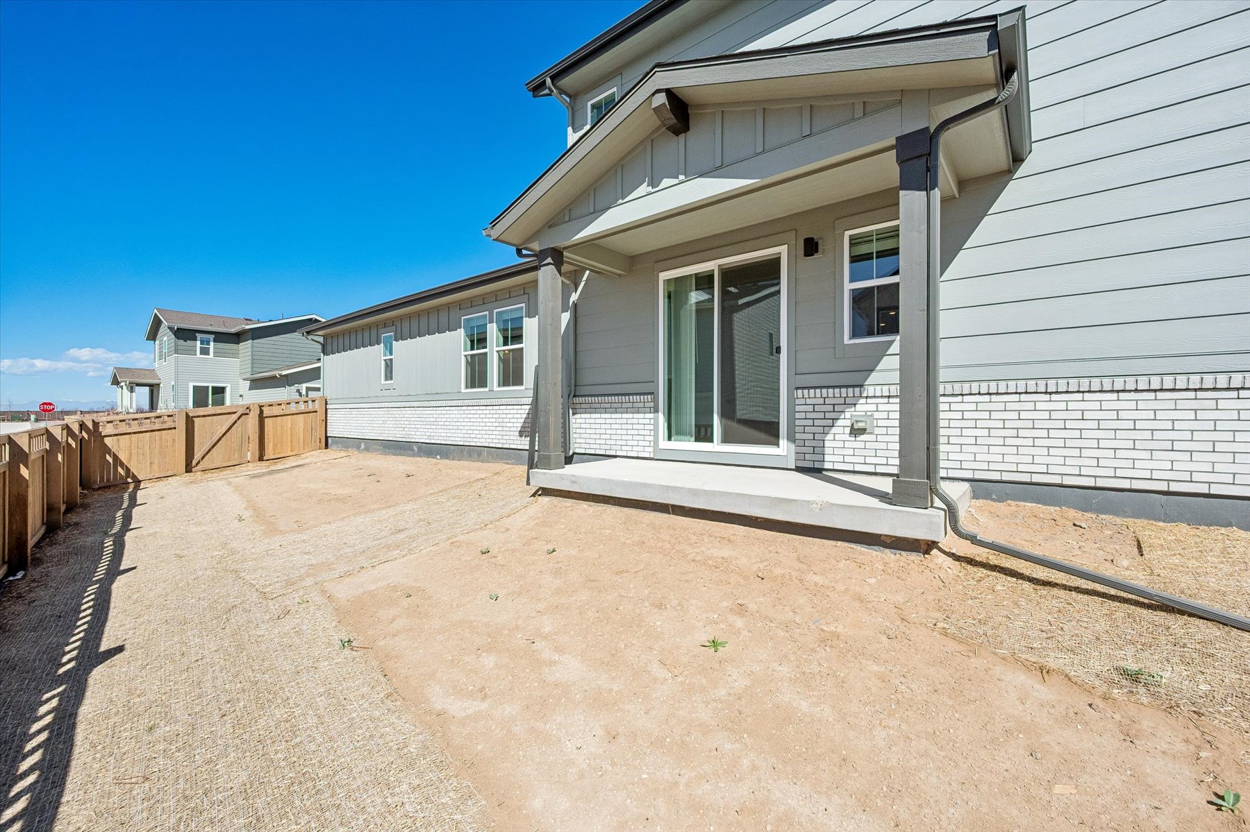 A house with a dirt yard.