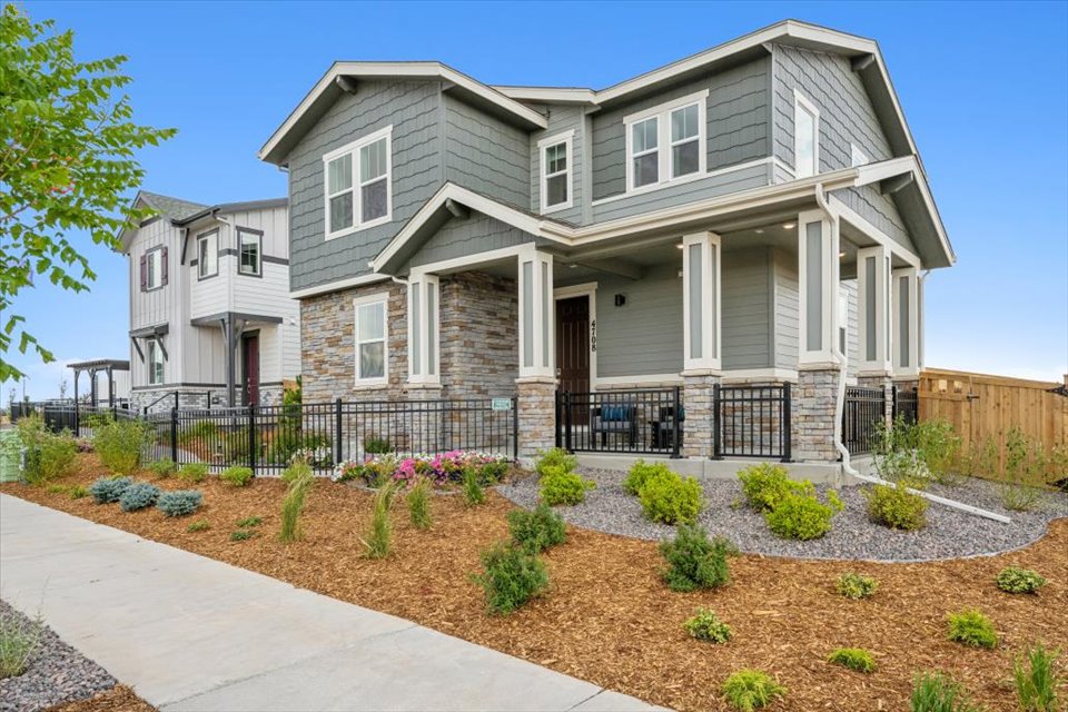 A house with a fence and a driveway.