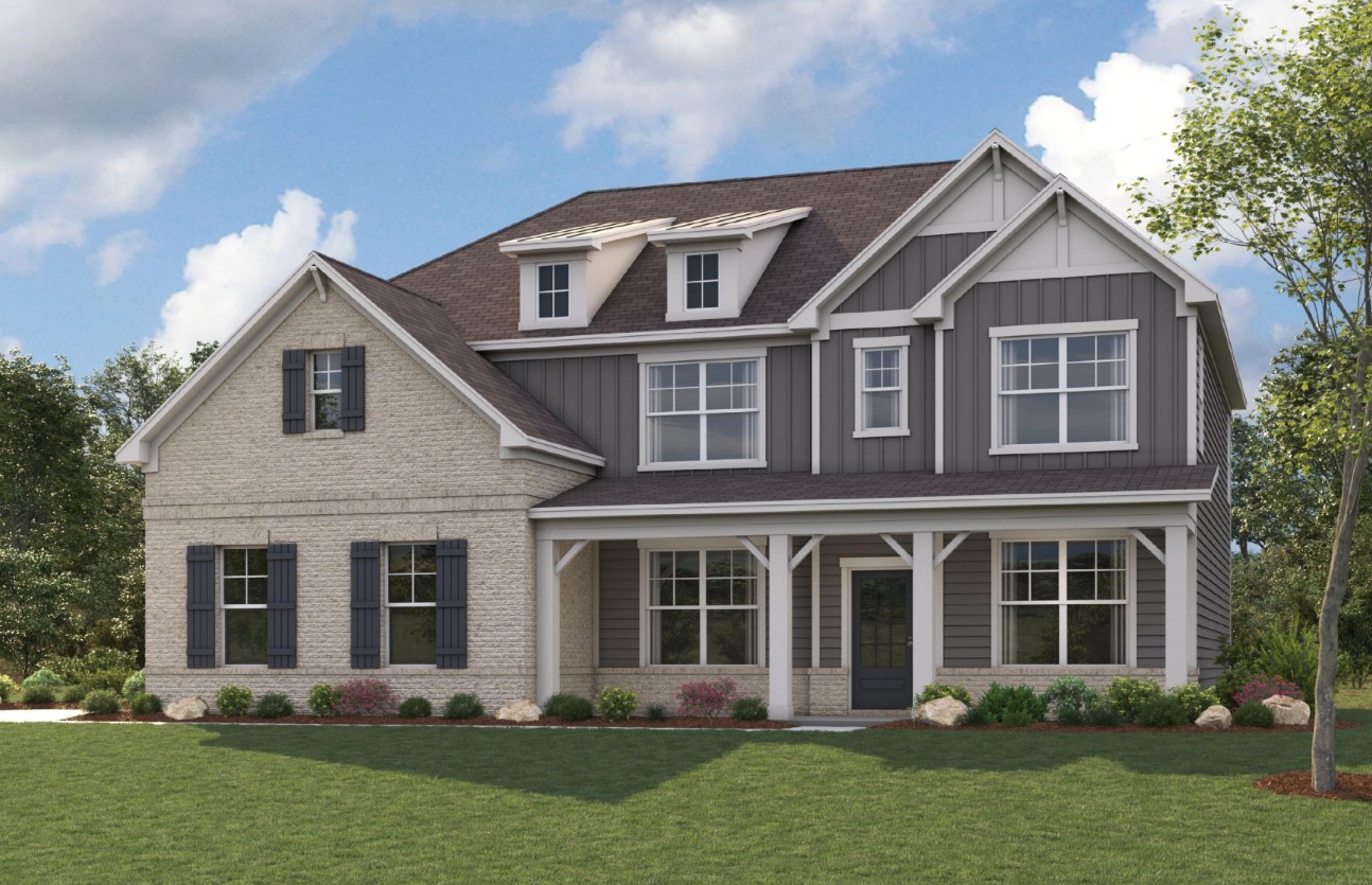 A house with a lawn in front.