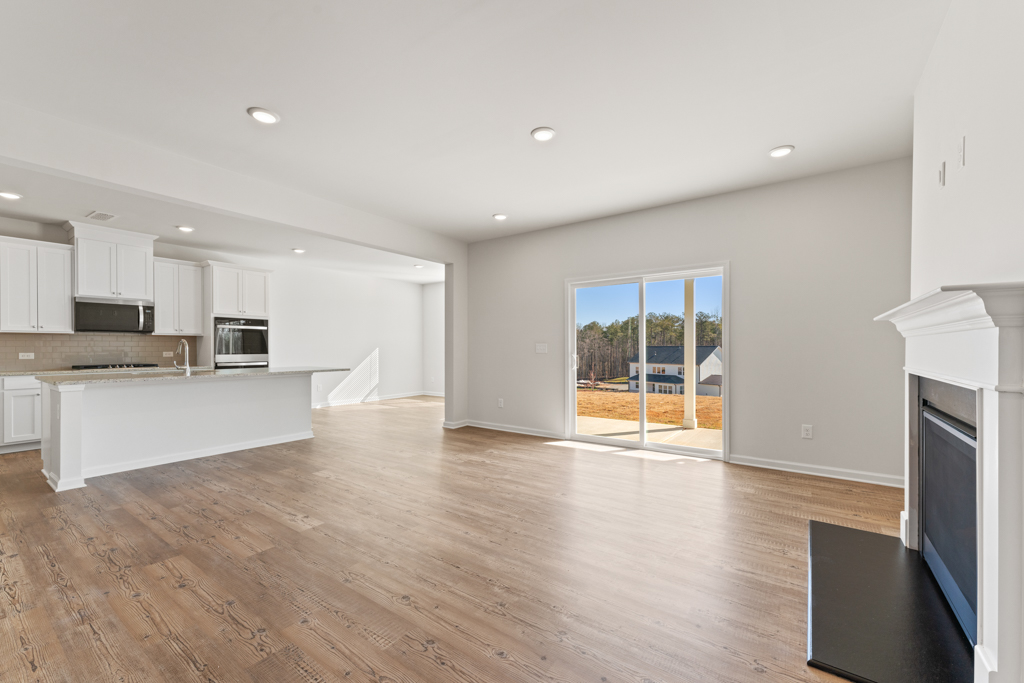 A large kitchen with white cabinets.