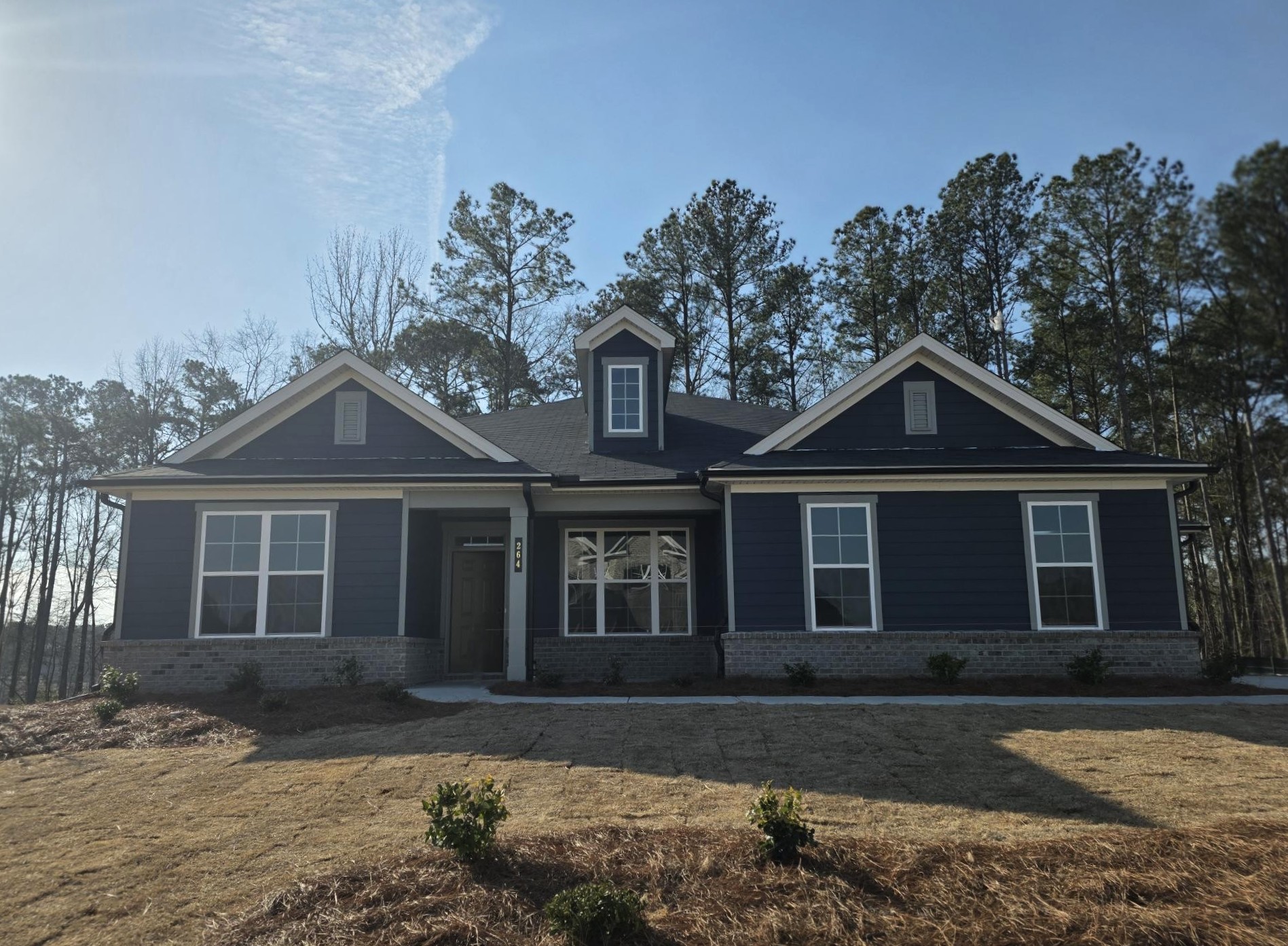 A house with a large front yard.