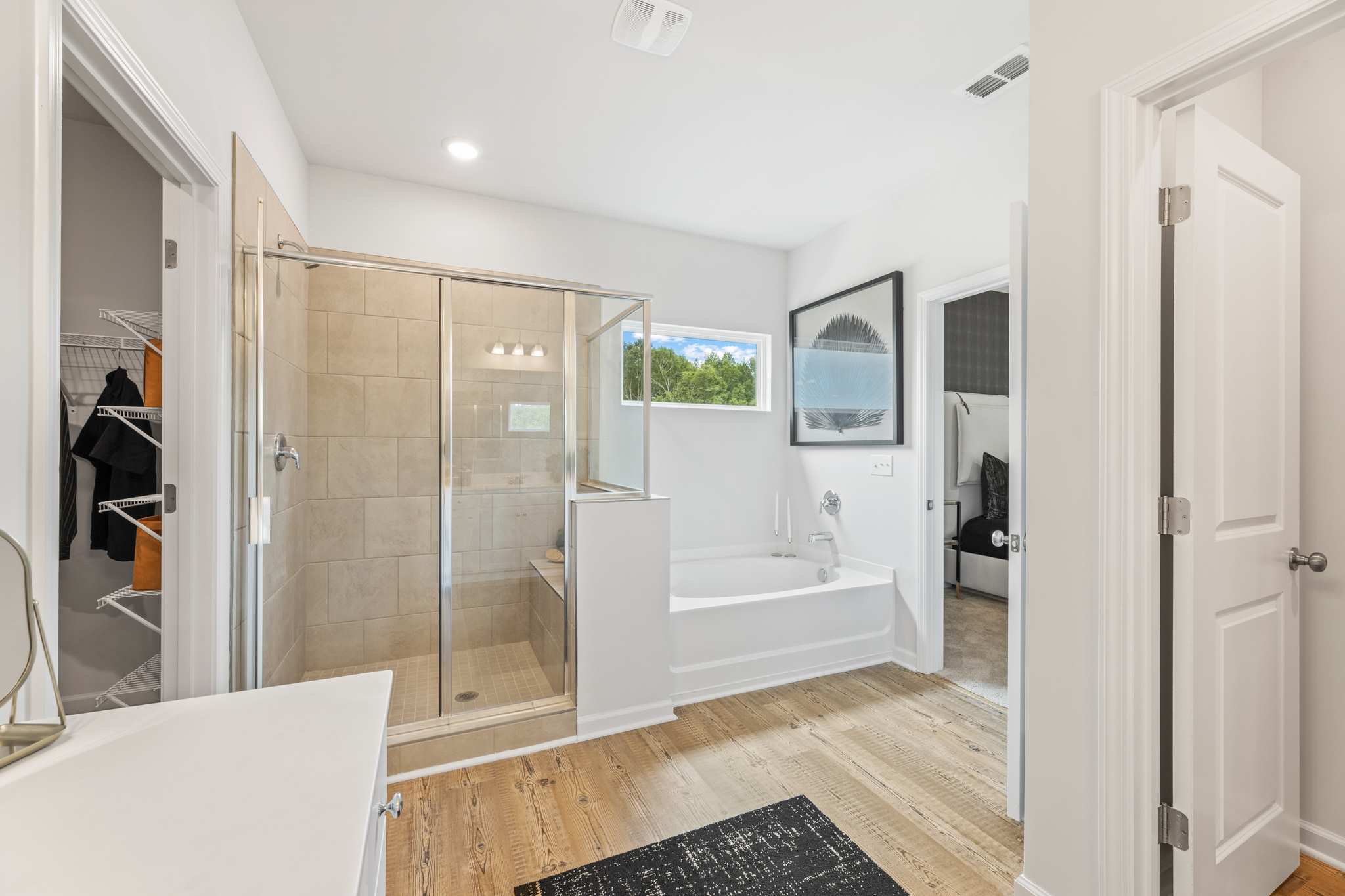 A bathroom with a glass shower.