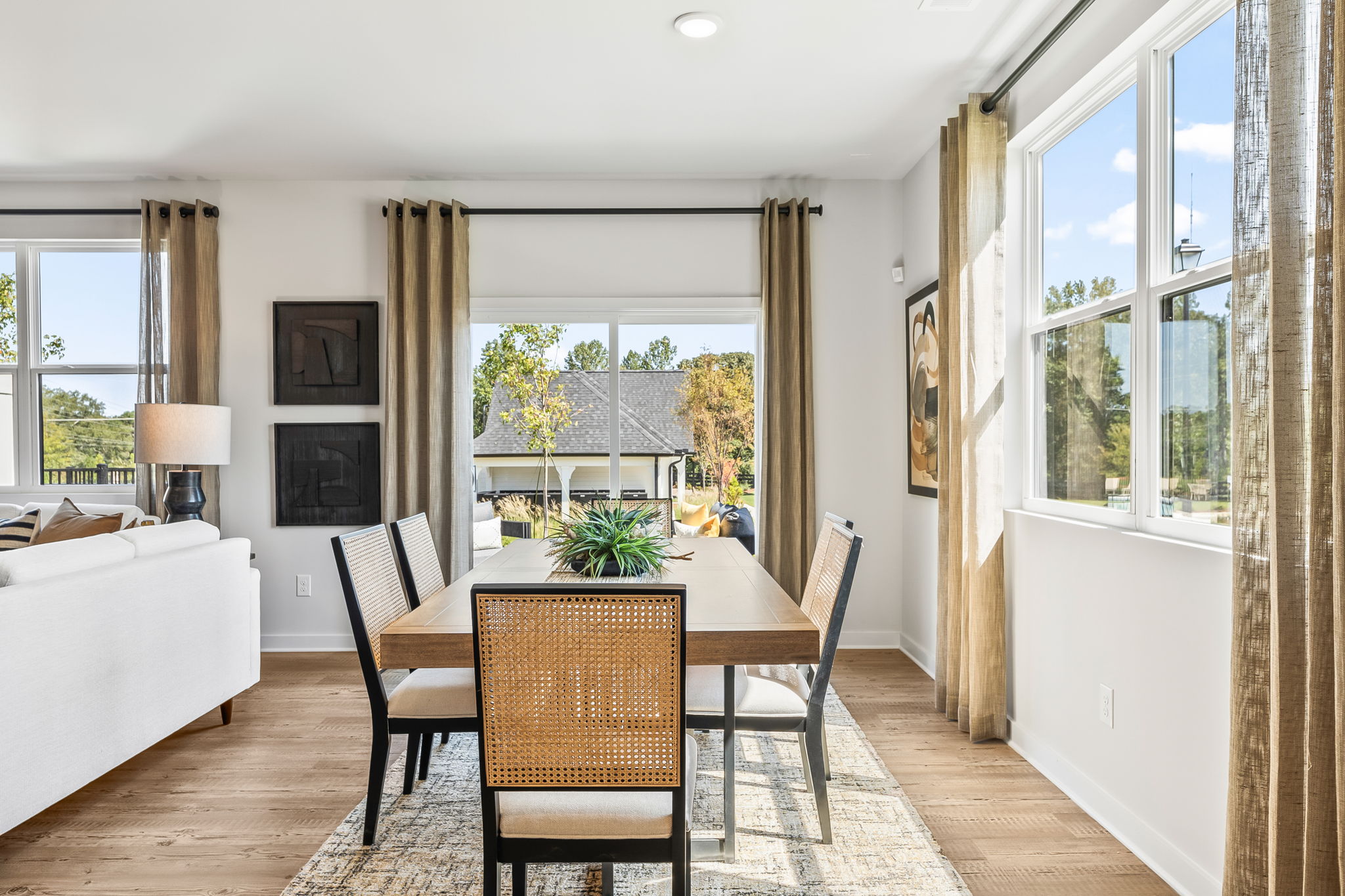 A dining room with a large window.