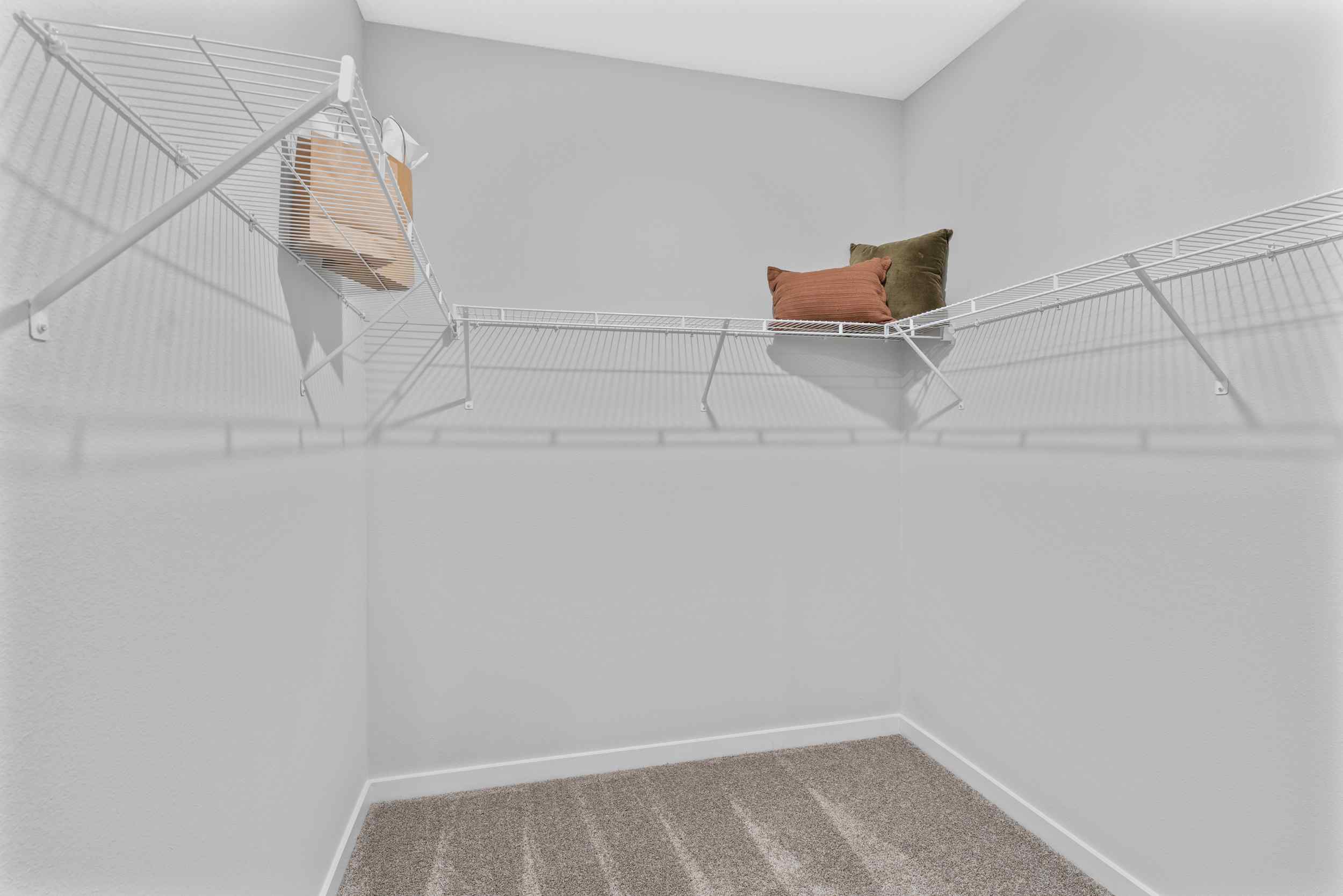 Silverbell II Model Home Primary Closet with Shelving at Camden Woods in Kingsland, GA