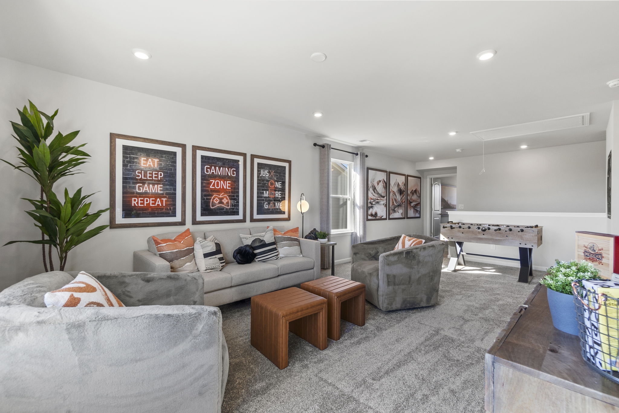 A living room with a couch and a table.