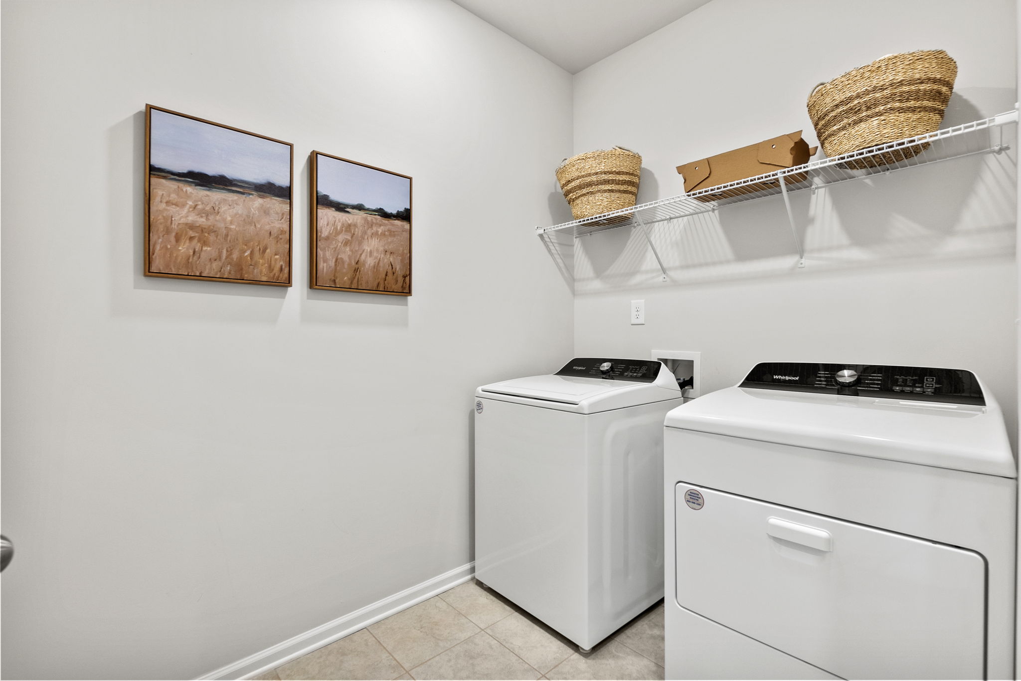A kitchen with a washer and dryer.
