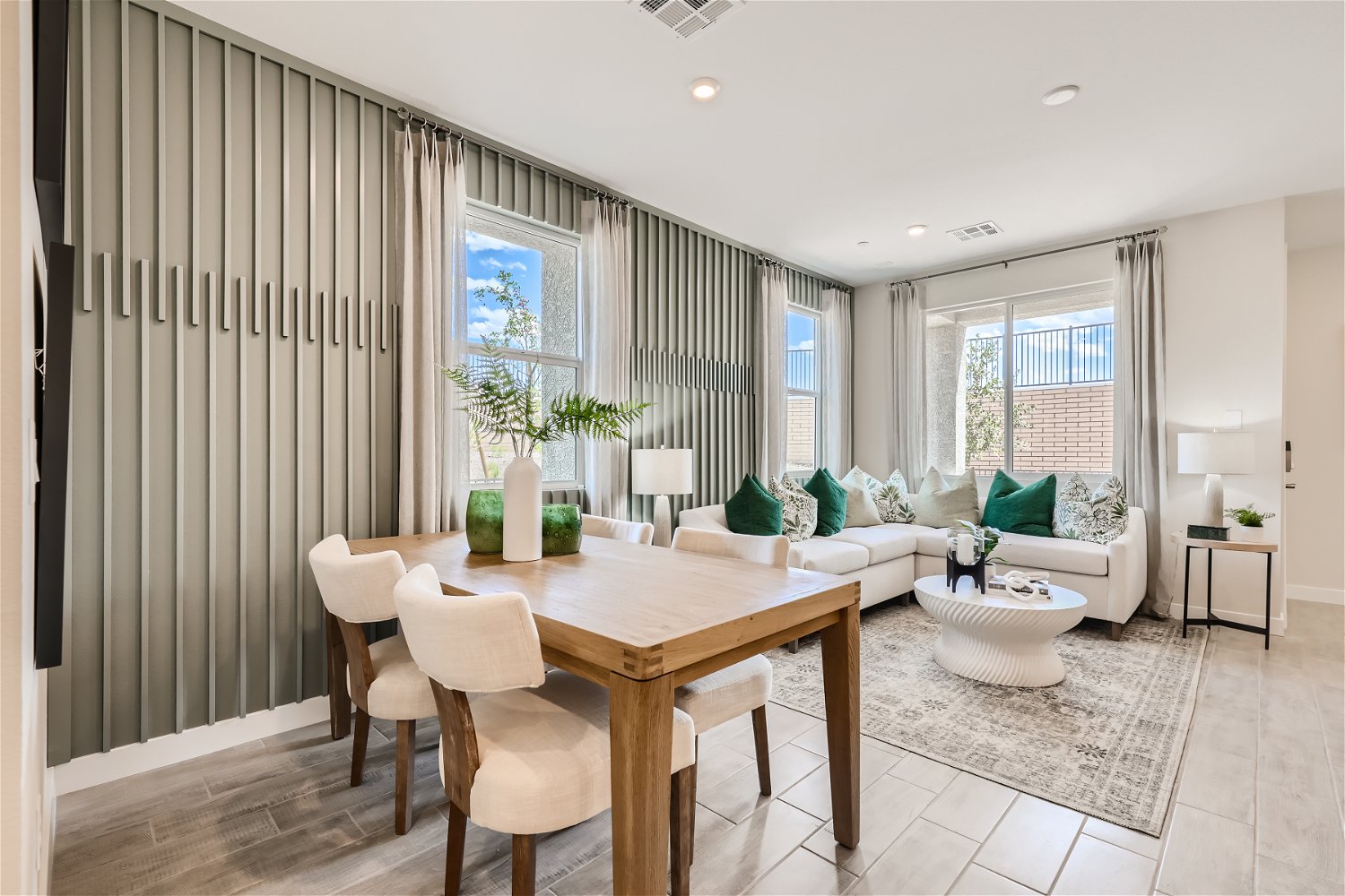 A room with a table and chairs.