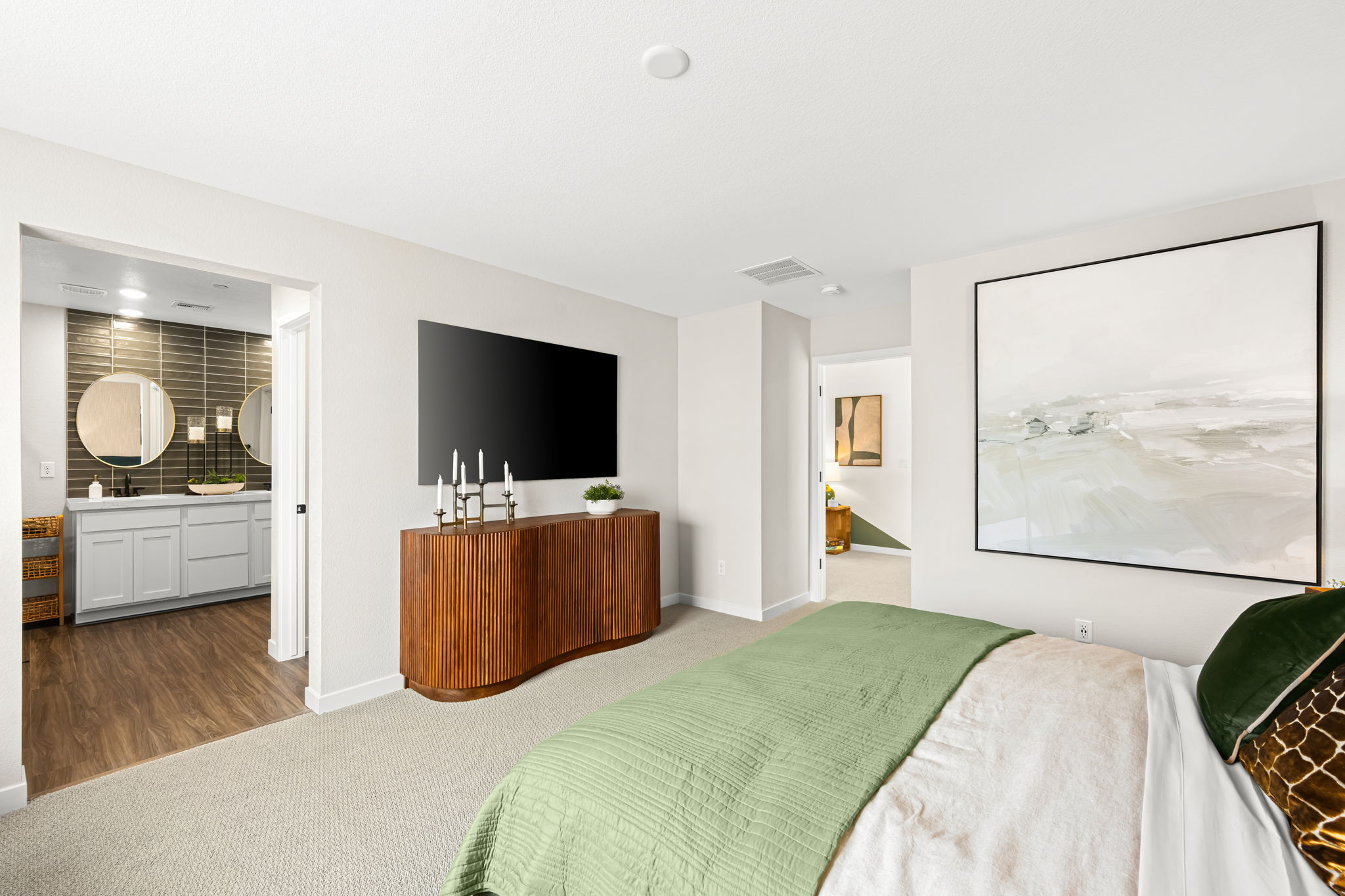 A bedroom with a tv and a bed.